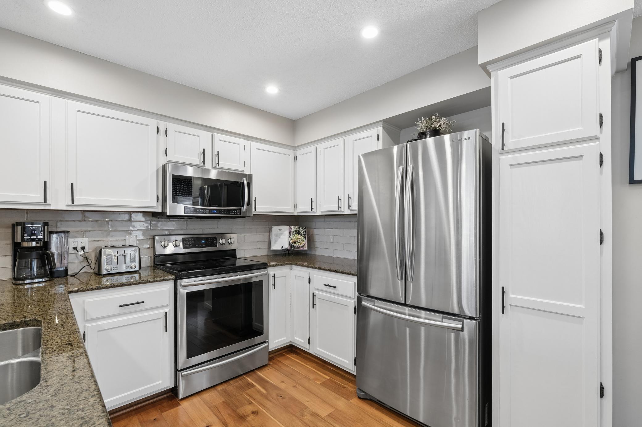 Engineered hardwood flooring throughout