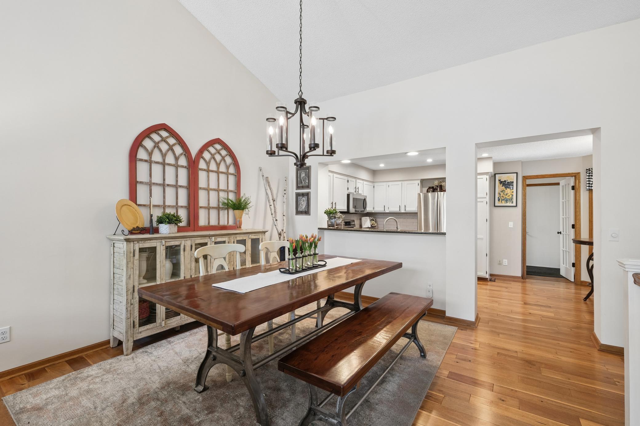The dining area is wonderful for entertaining-open onto the kitchen and great room. New on trend lighting.