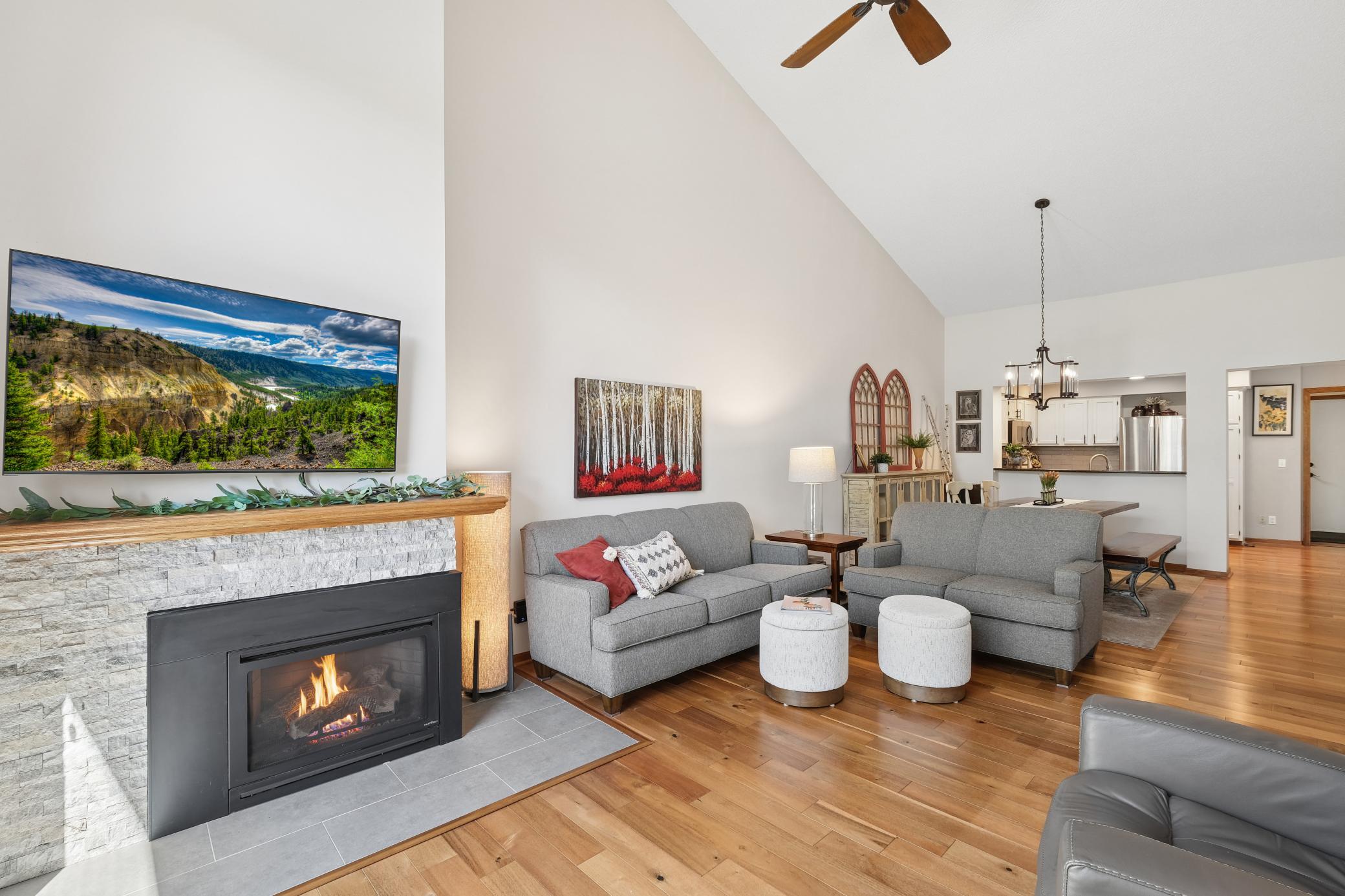 The gas fireplace has a newer fireplace surround to enjoy on those chilly nights. Gleaming hardwood floors add a touch of beauty.