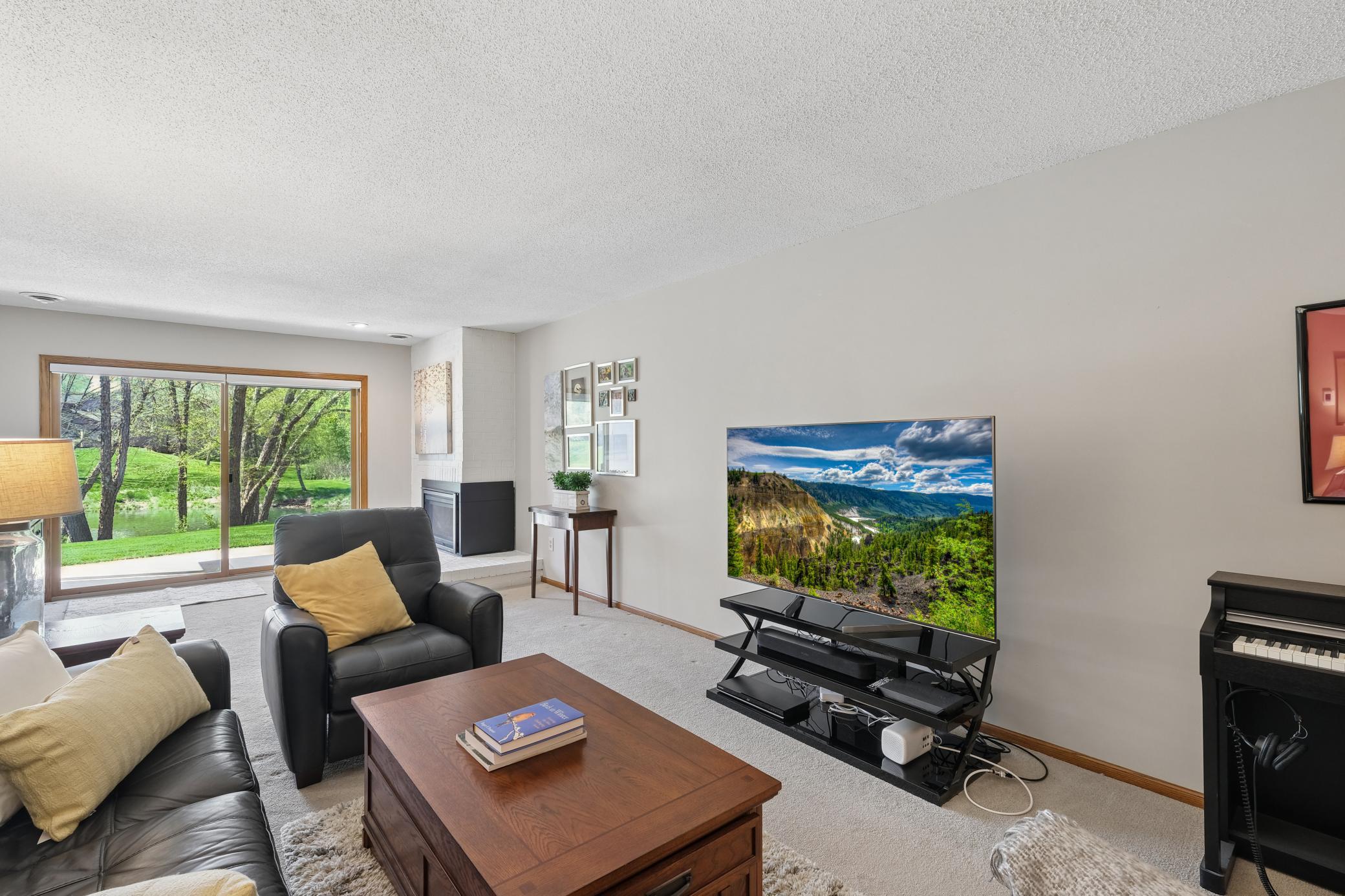 Enjoy the beautiful green space and pond sitting on the patio.