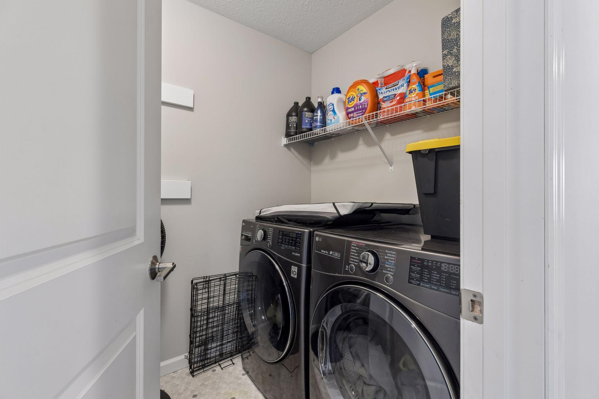 Laundry room with washer and dryer, conveniently located for everyday use.