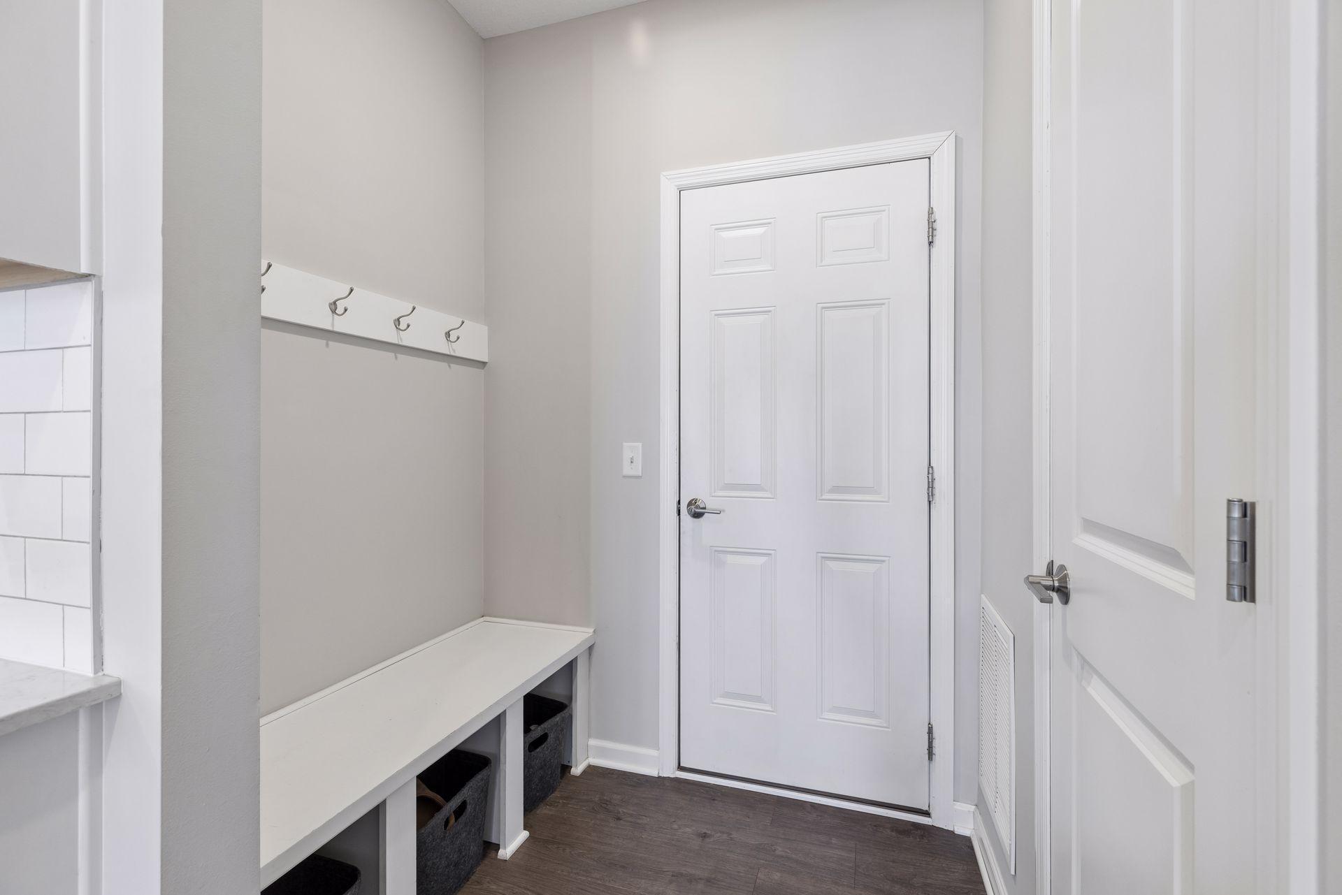 Mudroom with built-in hooks and storage space for coats, shoes, and everyday organization.