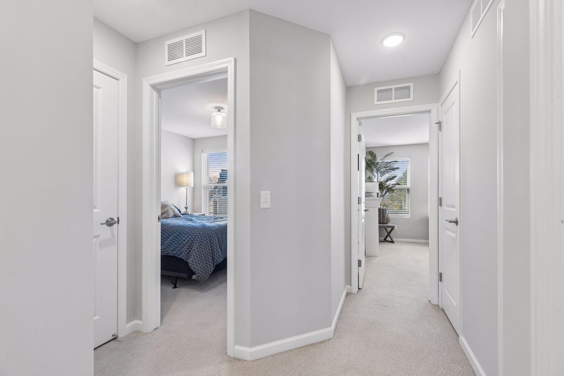 Upper-level hallway providing access to bedrooms and shared spaces.