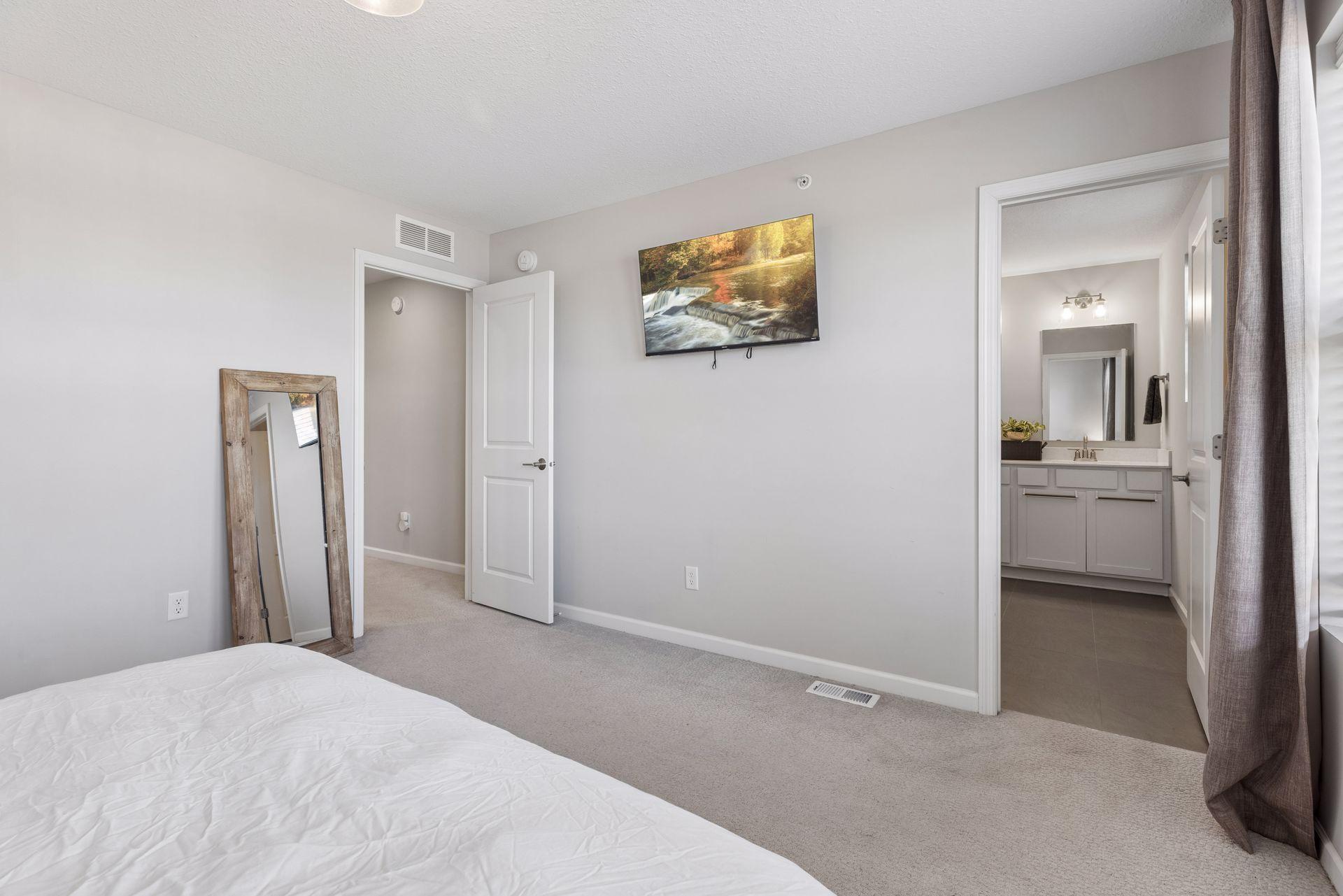Primary bedroom with direct access to attached private bathroom.