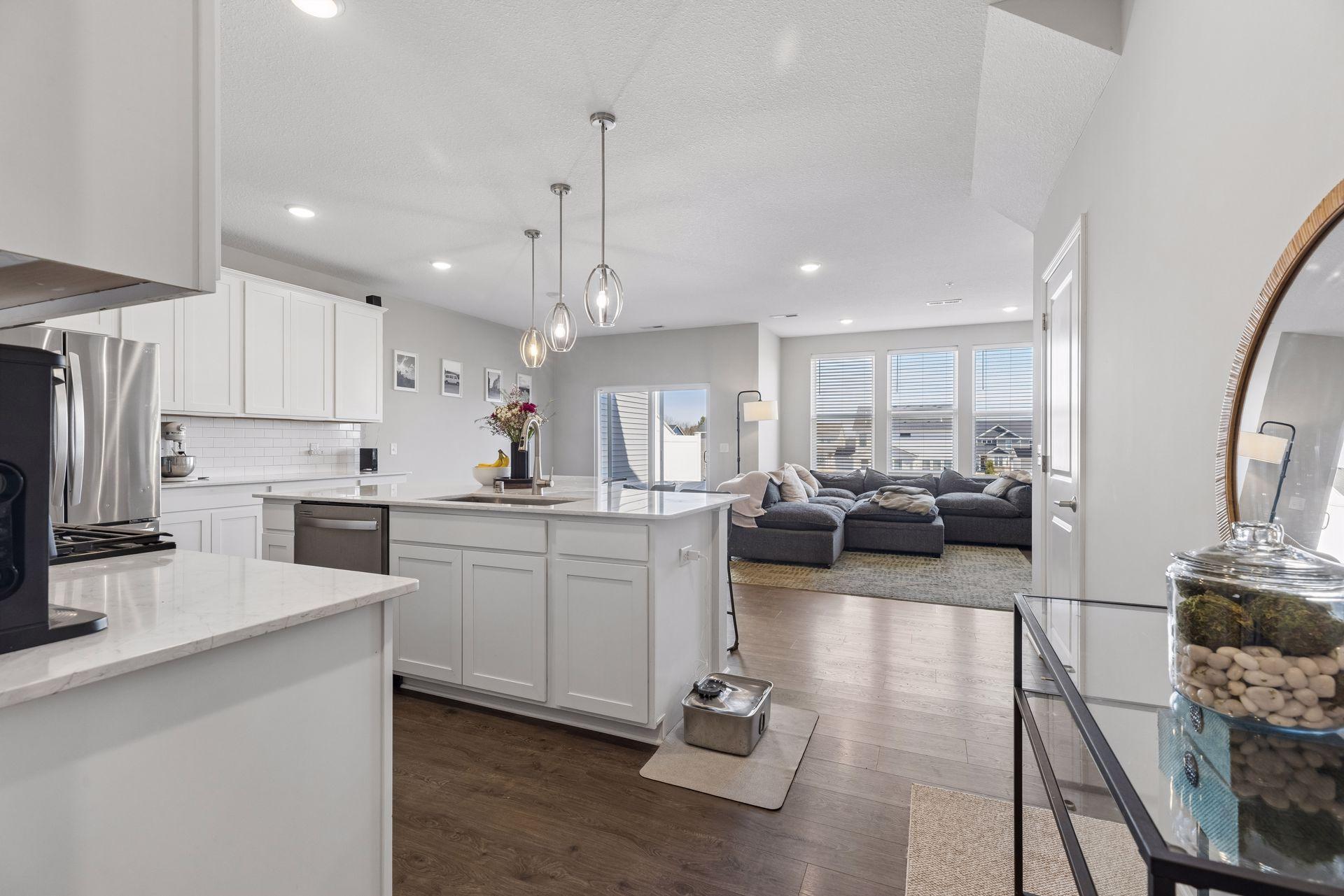 View toward kitchen entrance with seamless transition from entry to main living space.