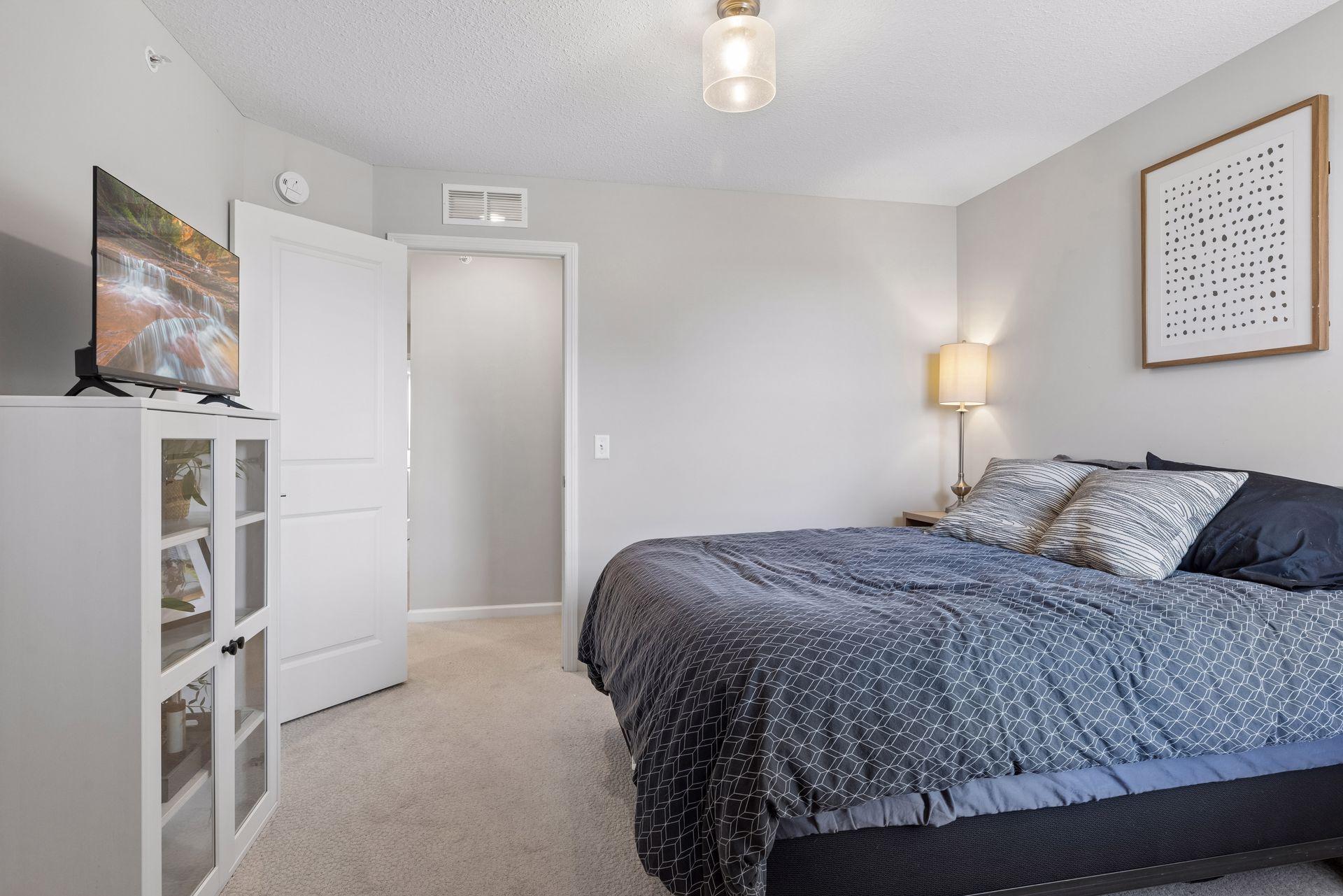 Alternate view of second bedroom showcasing layout and natural light.