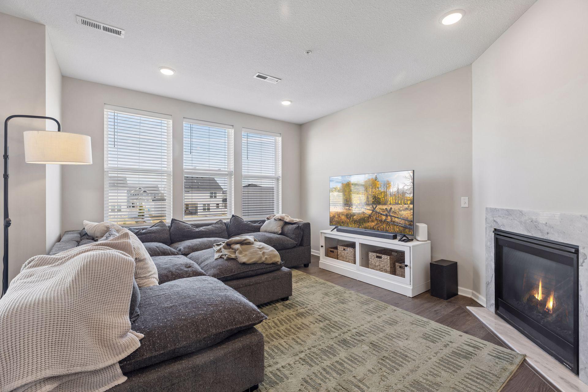 Living room with open-concept layout connecting seamlessly to the kitchen and dining areas.