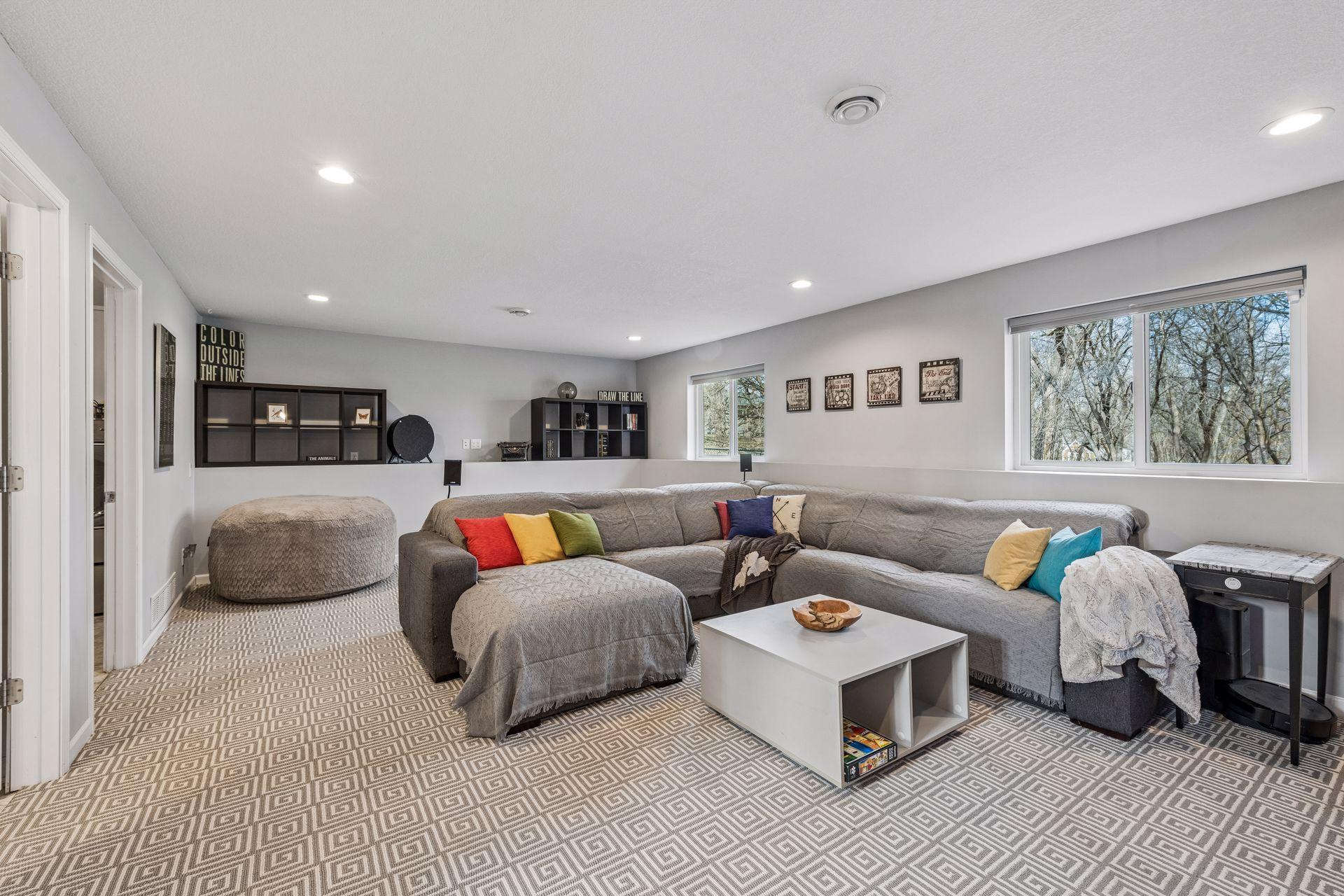 Huge lower level family room with lookout windows.