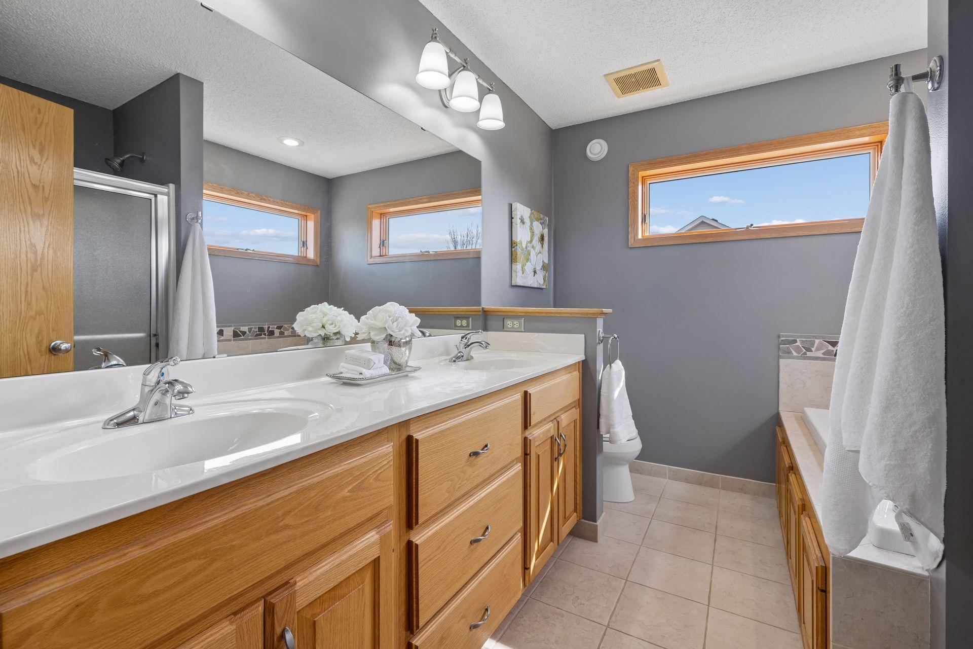 Primary bath with double sink and separate shower & tub