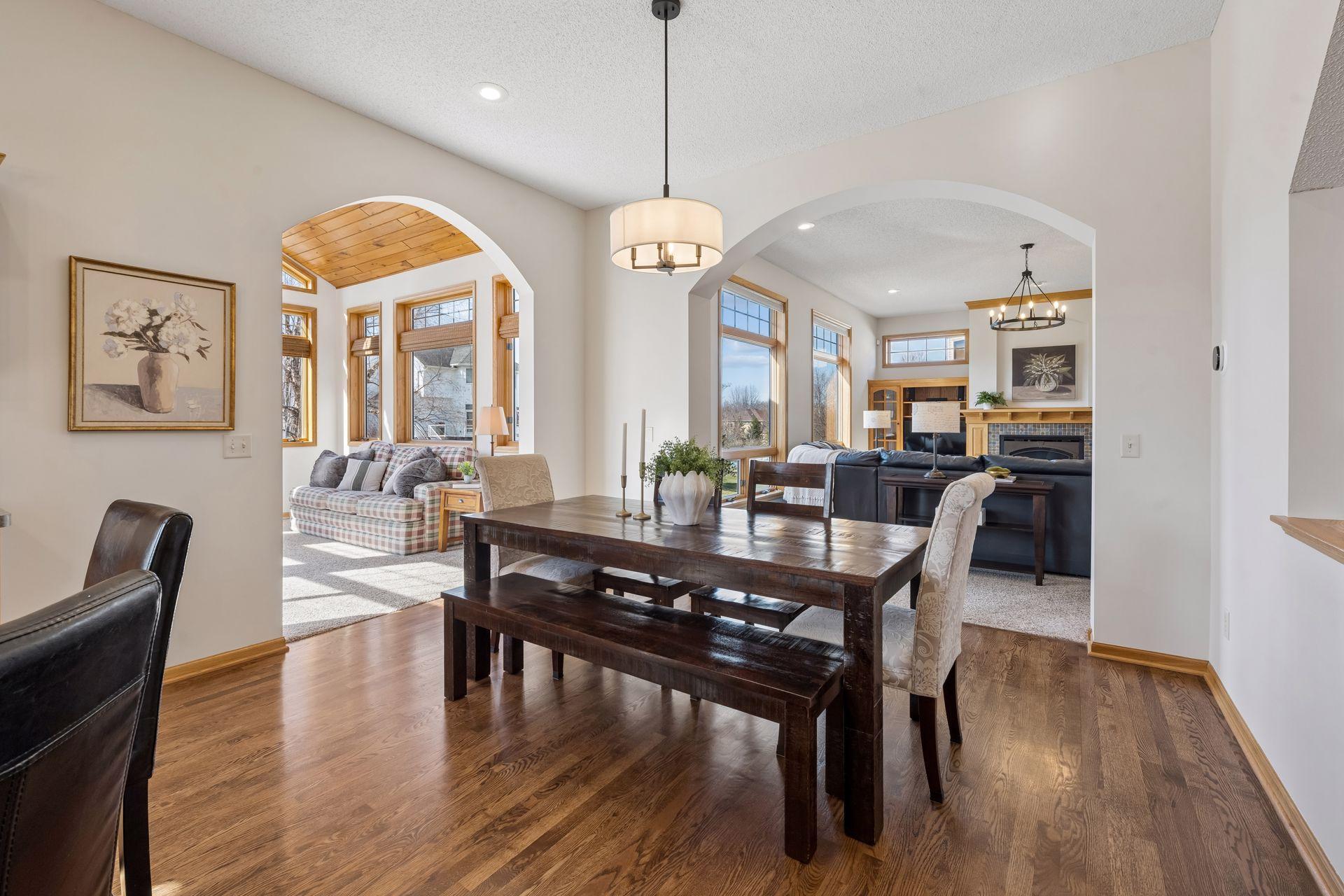 The dining area flows effortlessly with the kitchen, great room and porch
