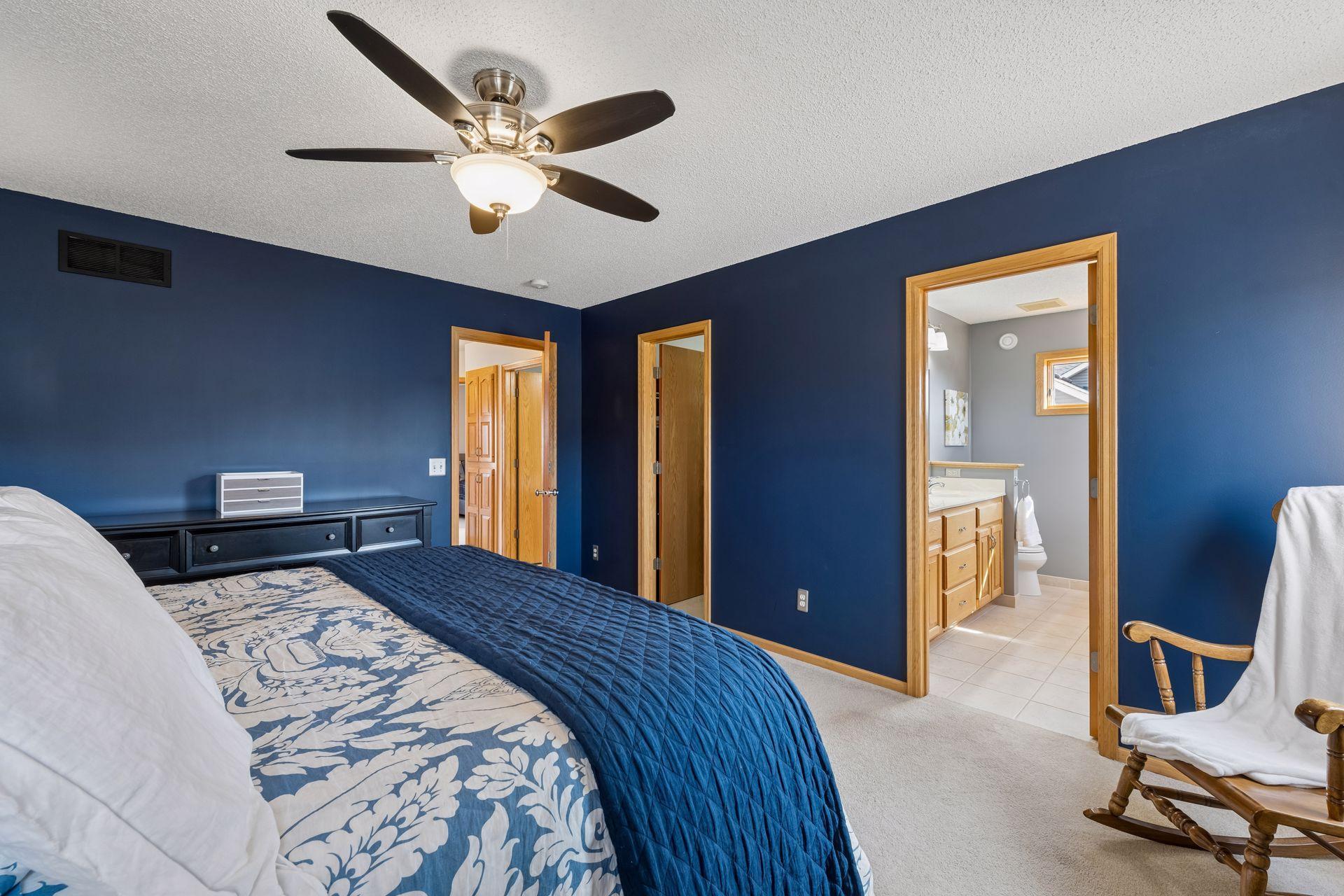 Primary bedroom w/ walk-in closet and private bath