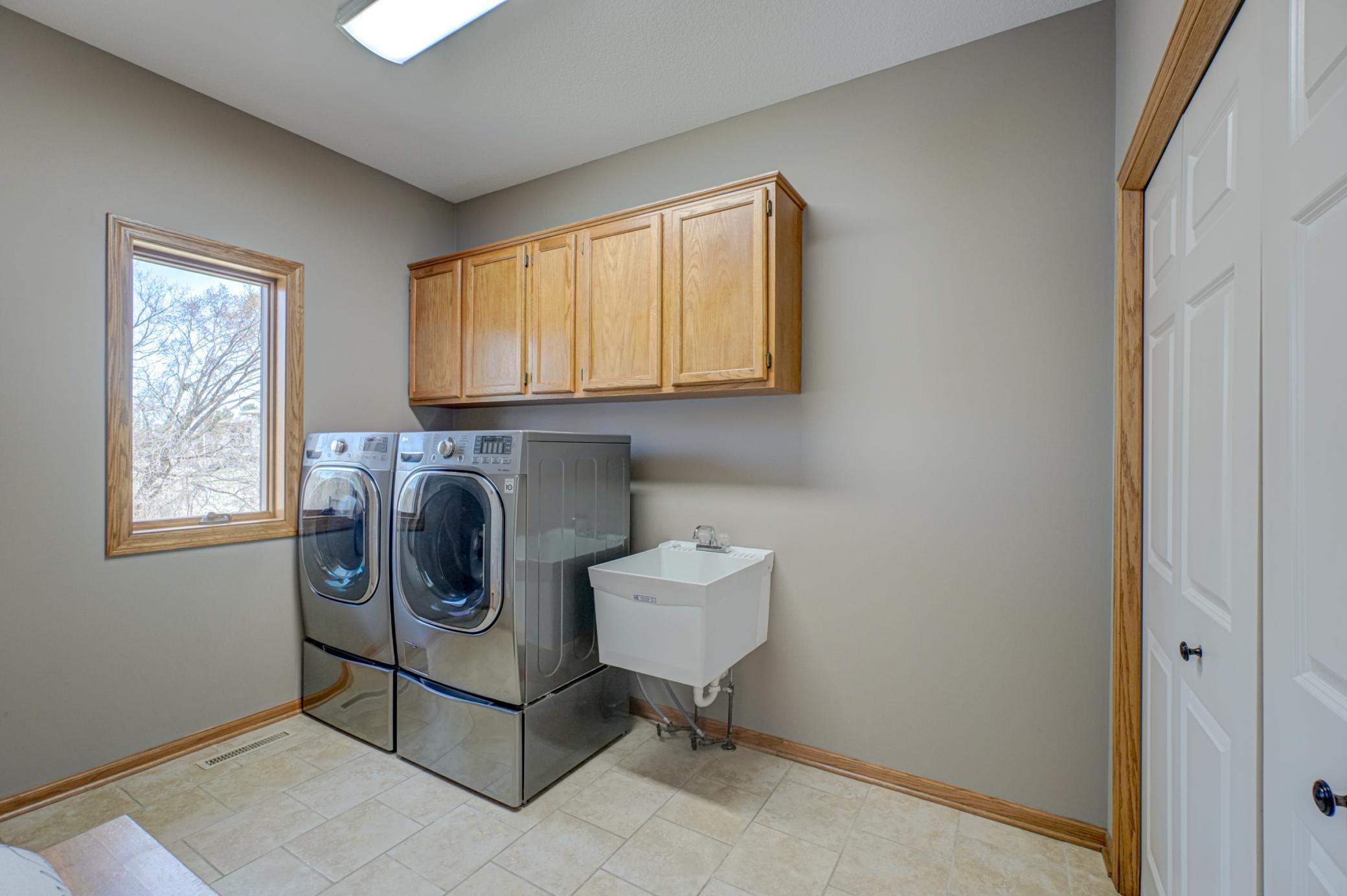Main-floor laundry off the mudroom for functional everyday living!