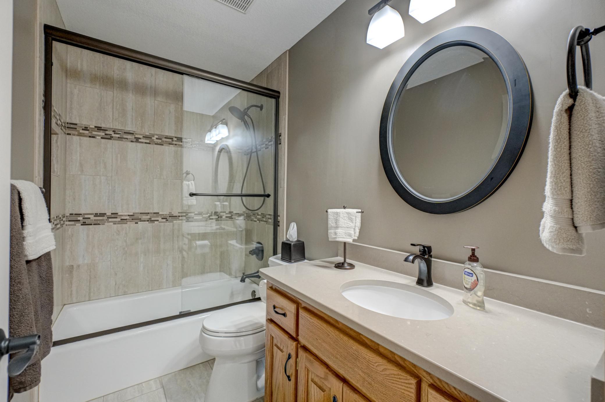 Upper-level full bathroom beautifully updated and designed for convenient everyday living
