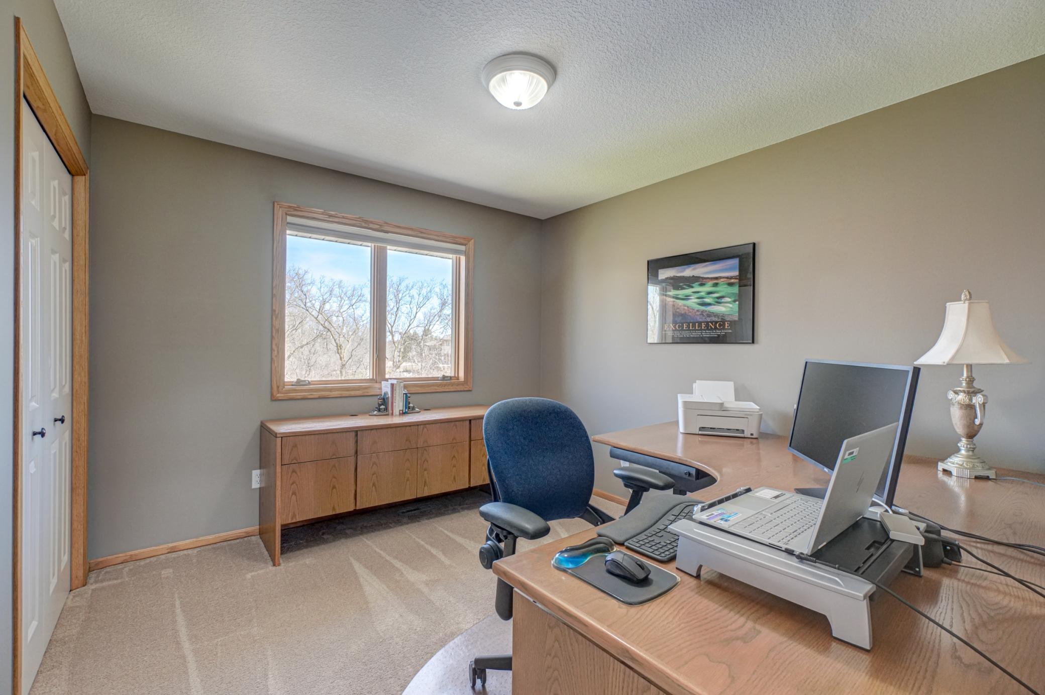 Fourth bedroom upstairs provides versatile space for a home office!