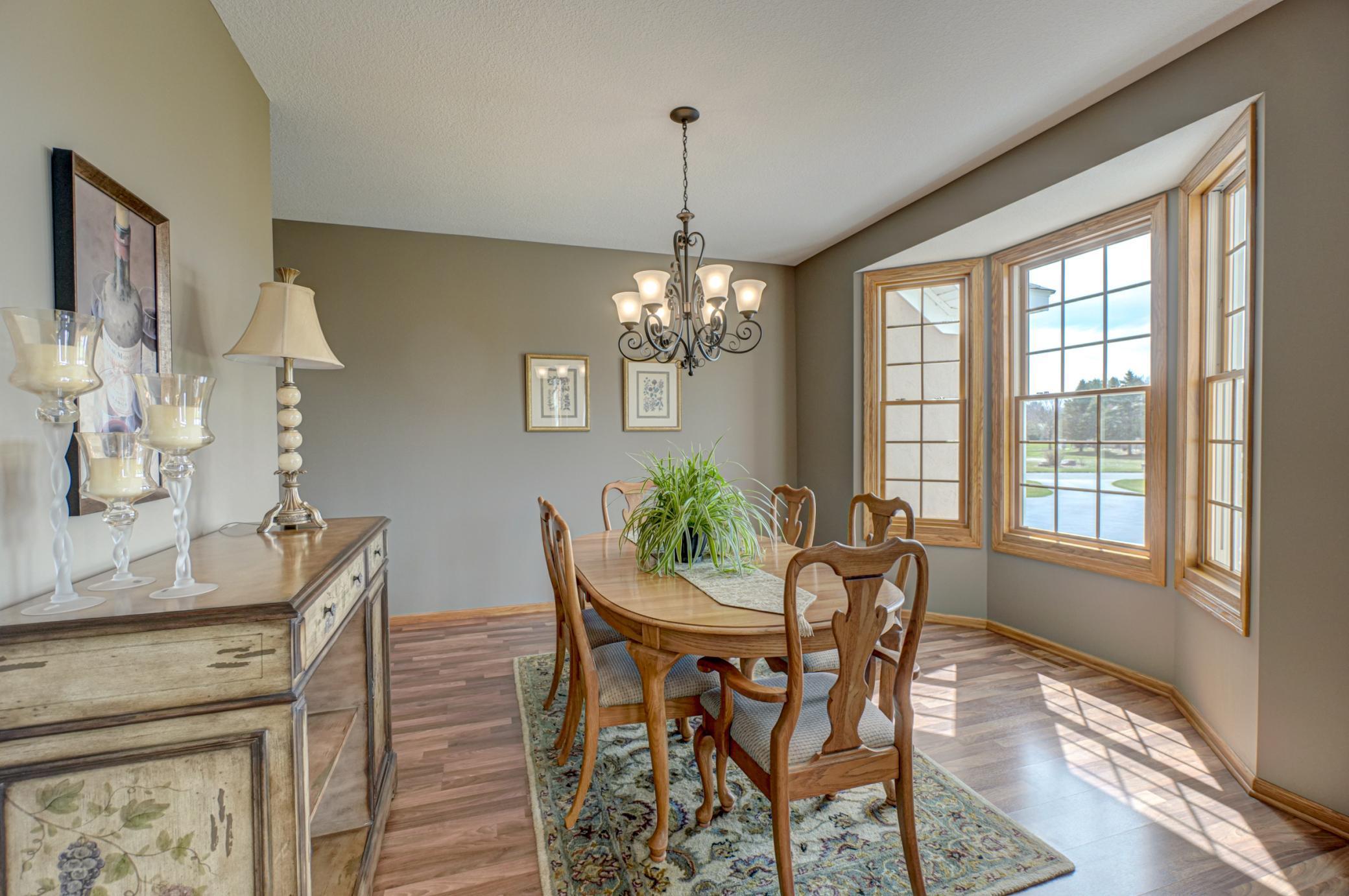 Elegant formal dining room offering an inviting space for entertaining!