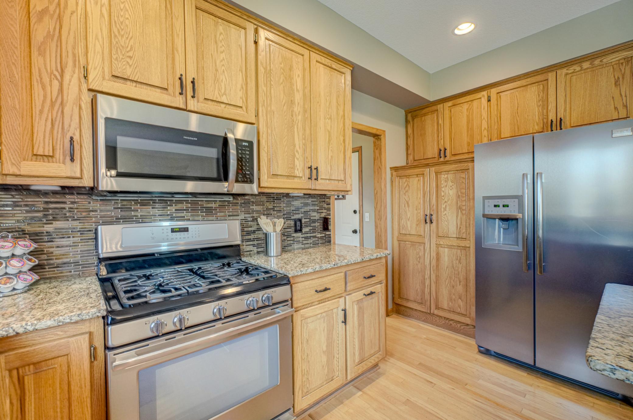Designed for organization with abundant cabinetry and a spacious walk-in pantry