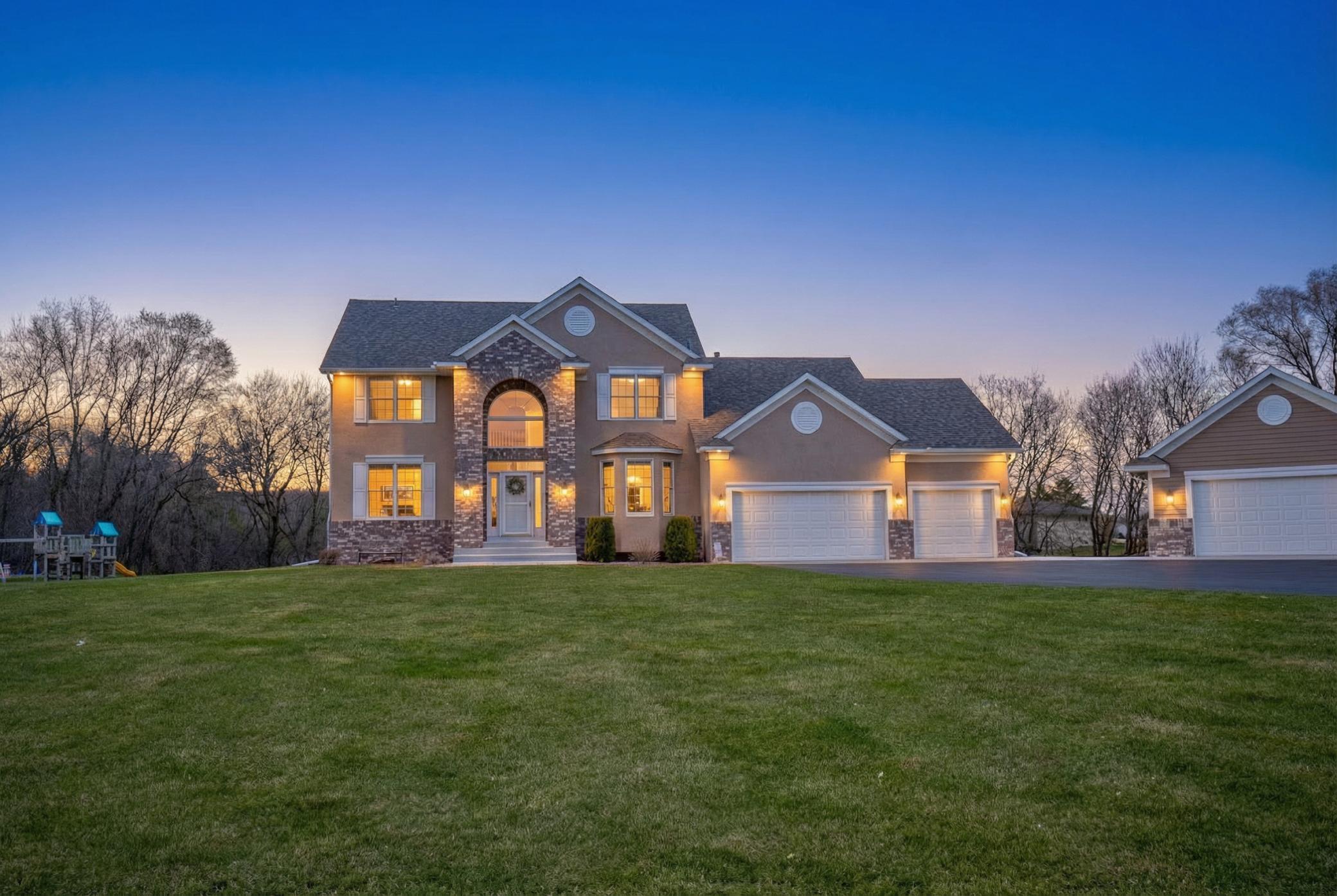 Welcome to 1480 Oryan Trl N - A beautifully updated two-story featuring a rare 7-stall heated, insulated garage with finished epoxy floors, perfect for car enthusiasts or hobbyists!