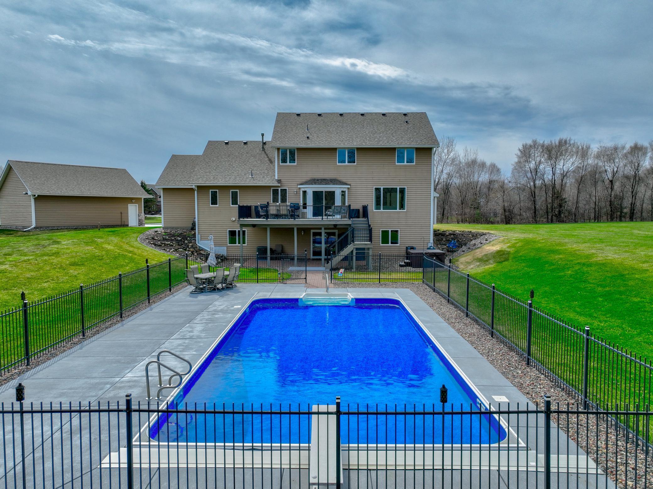 Step outside to your own private retreat—complete with a heated pool and hot tub, perfect for relaxation and entertaining