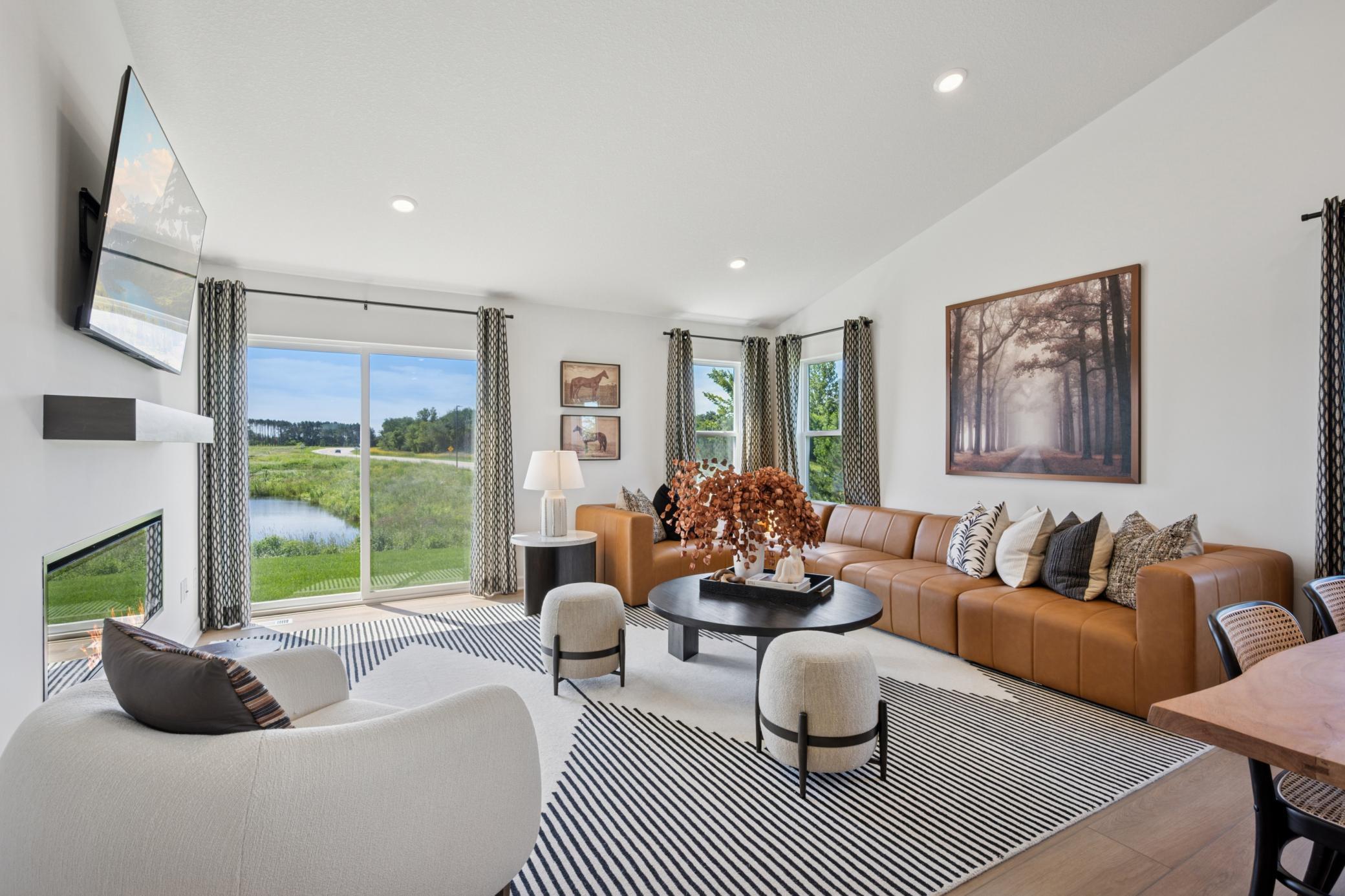(Photo of a model home, finishes will vary) Airy and inviting, the Great Room is ideal for watching movies with the family and hosting special celebrations with guests.
