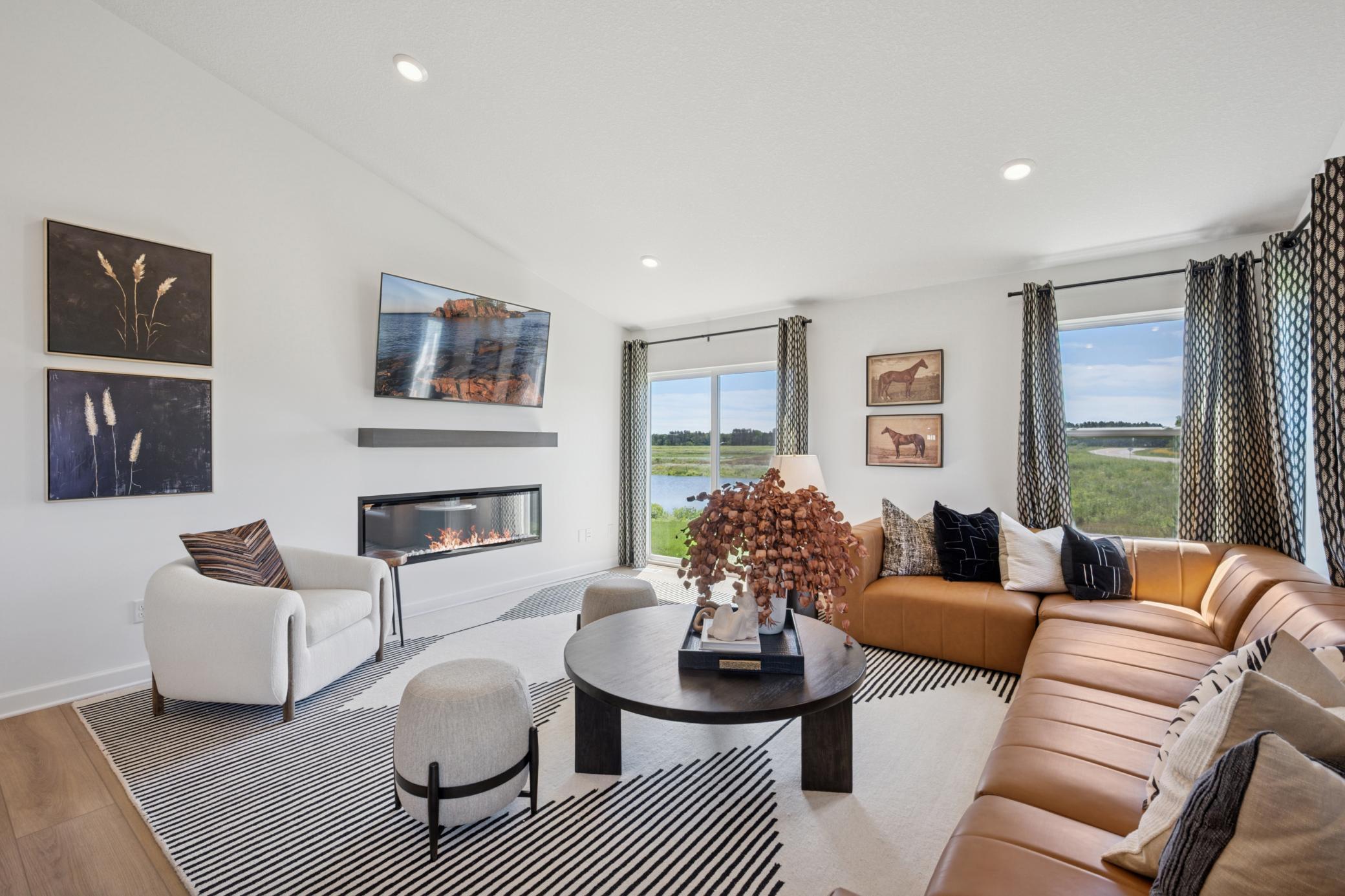 (Photo of a model home, finishes will vary) Open the adjacent glass-sliders to invite a refreshing breeze throughout the home