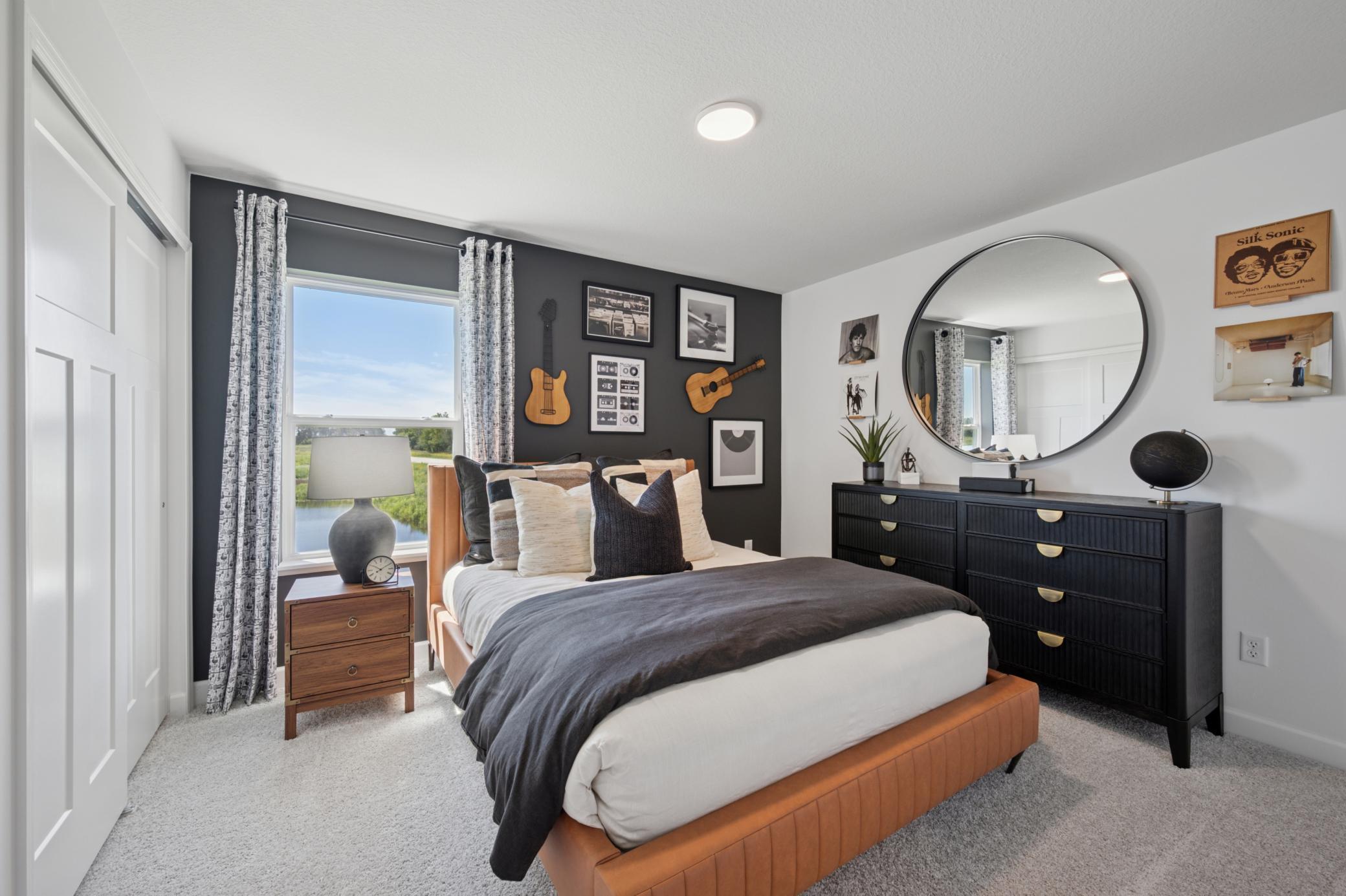 (Photo of a model home, finishes will vary) Two secondary bedrooms are located on the main level, along with the owner’s suite, providing peaceful havens.
