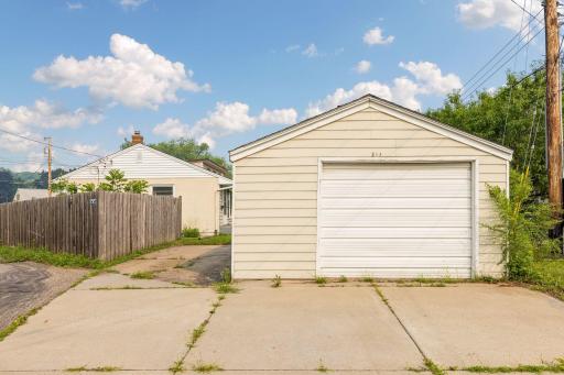 Oversized detached one-car garage just steps from the home with a spacious concrete driveway.