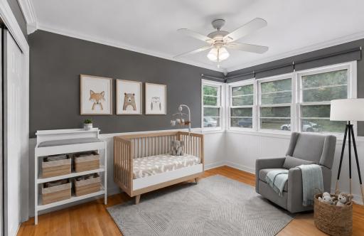 The second bedroom has multiple windows creating a warm and inviting retreat. **Virtually staged to show design options.**