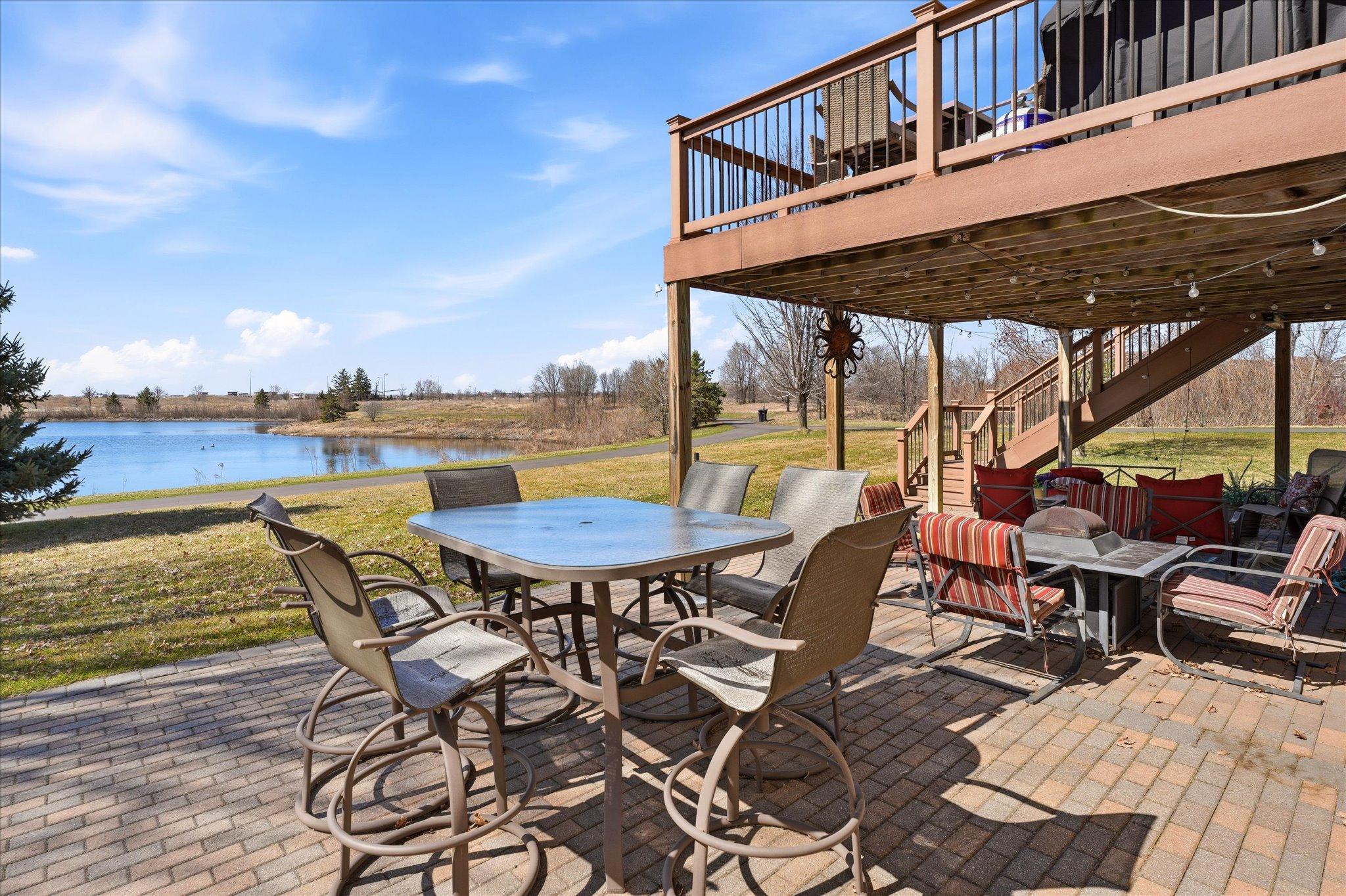 Enjoy private pond views and sunsets all year long from your deck and paver patio