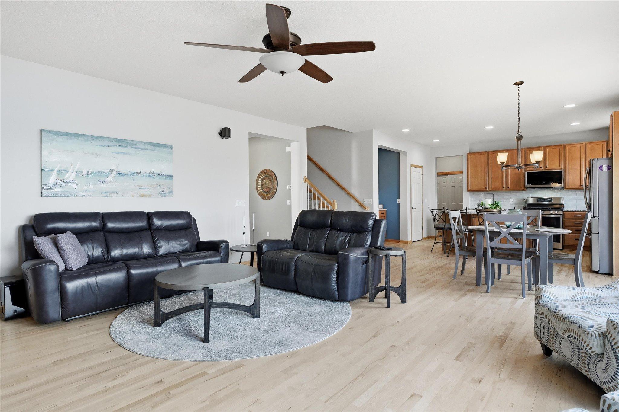 Open main floor Kitchen, Family and Dining Rooms with refinished maple hardwood floors