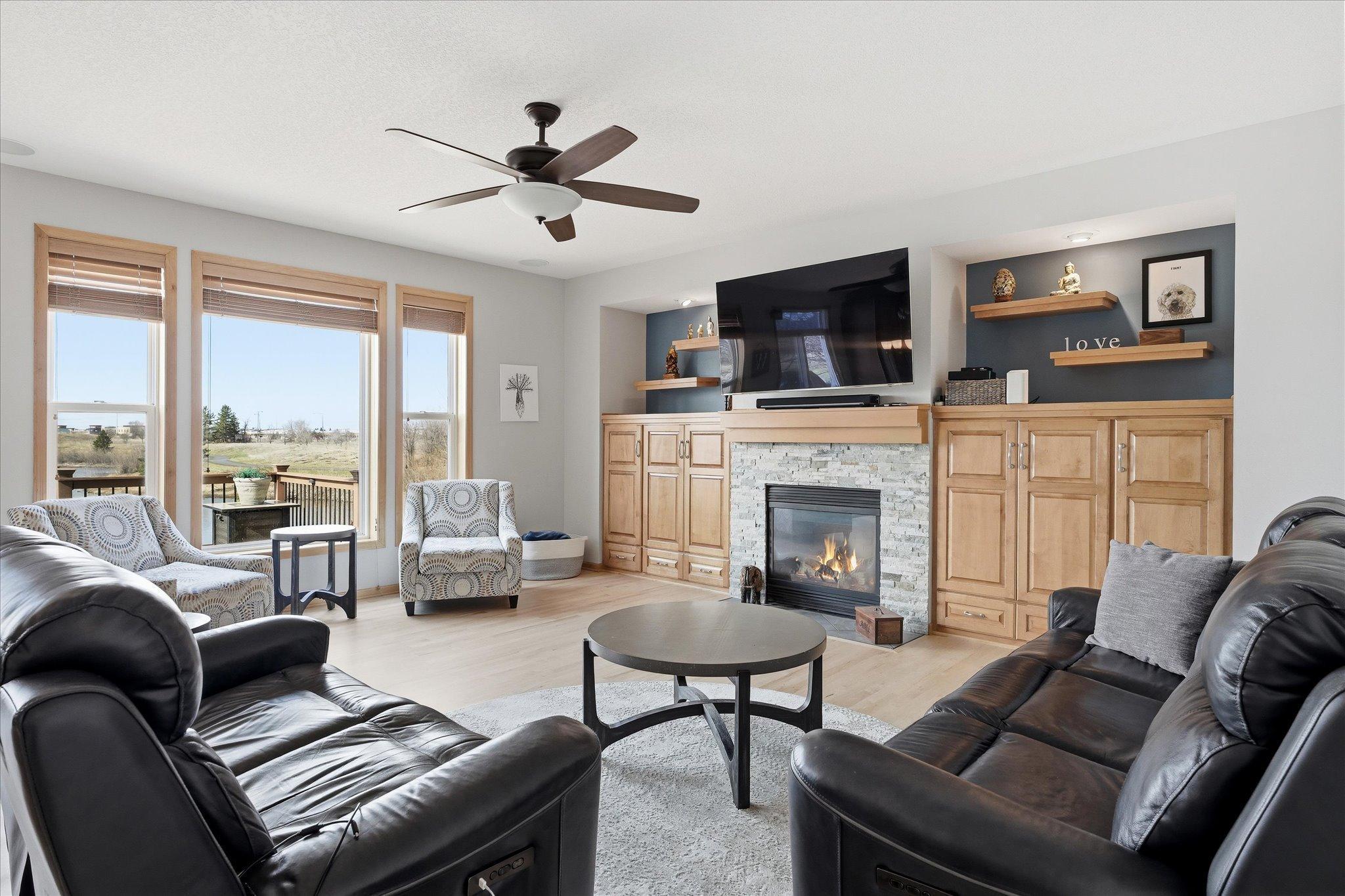 Enjoy beautiful pond views and our cozy gas fireplace in your open Family Room