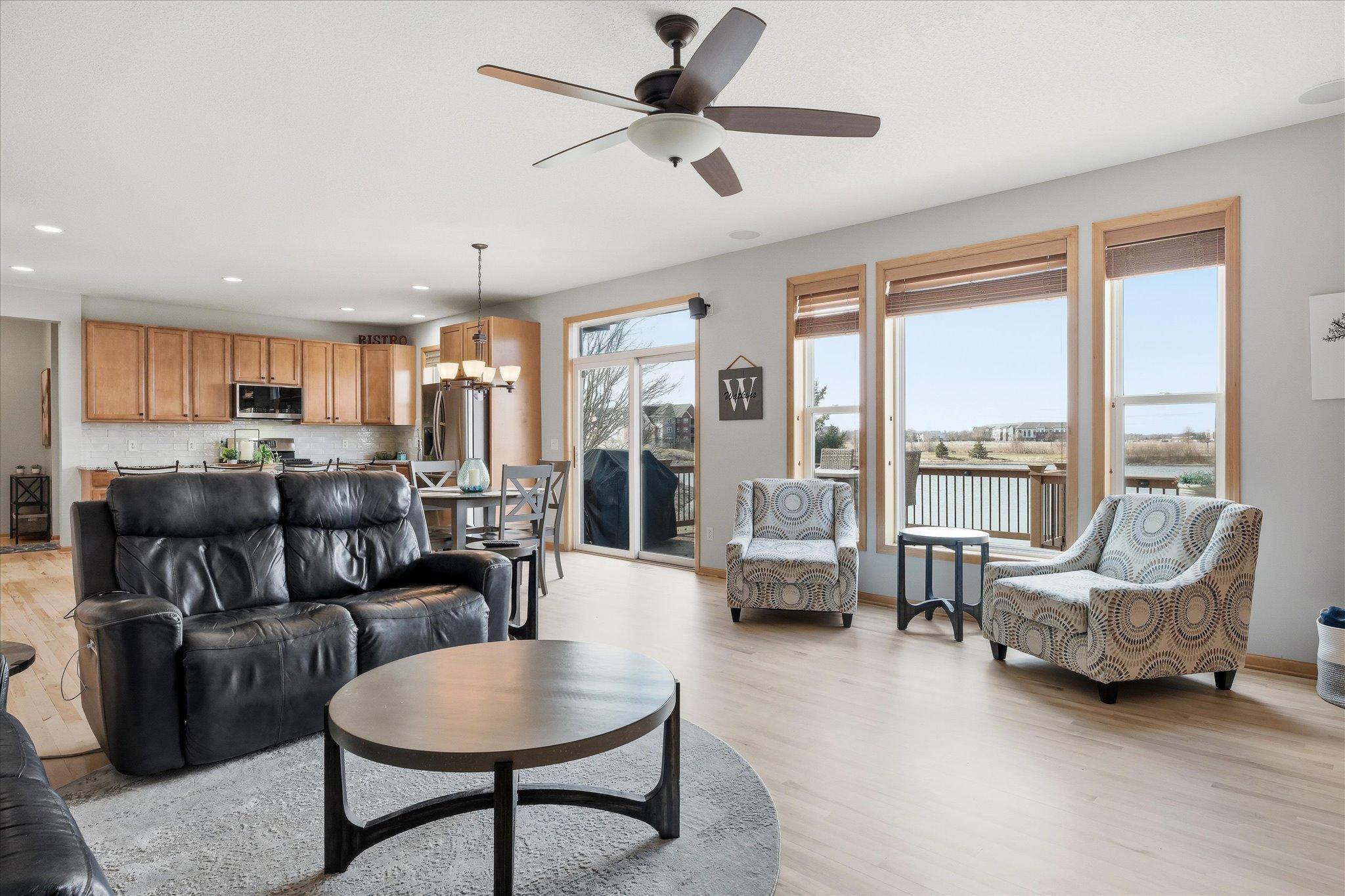 Open main floor Kitchen, Family and Dining Rooms with refinished maple hardwood floors