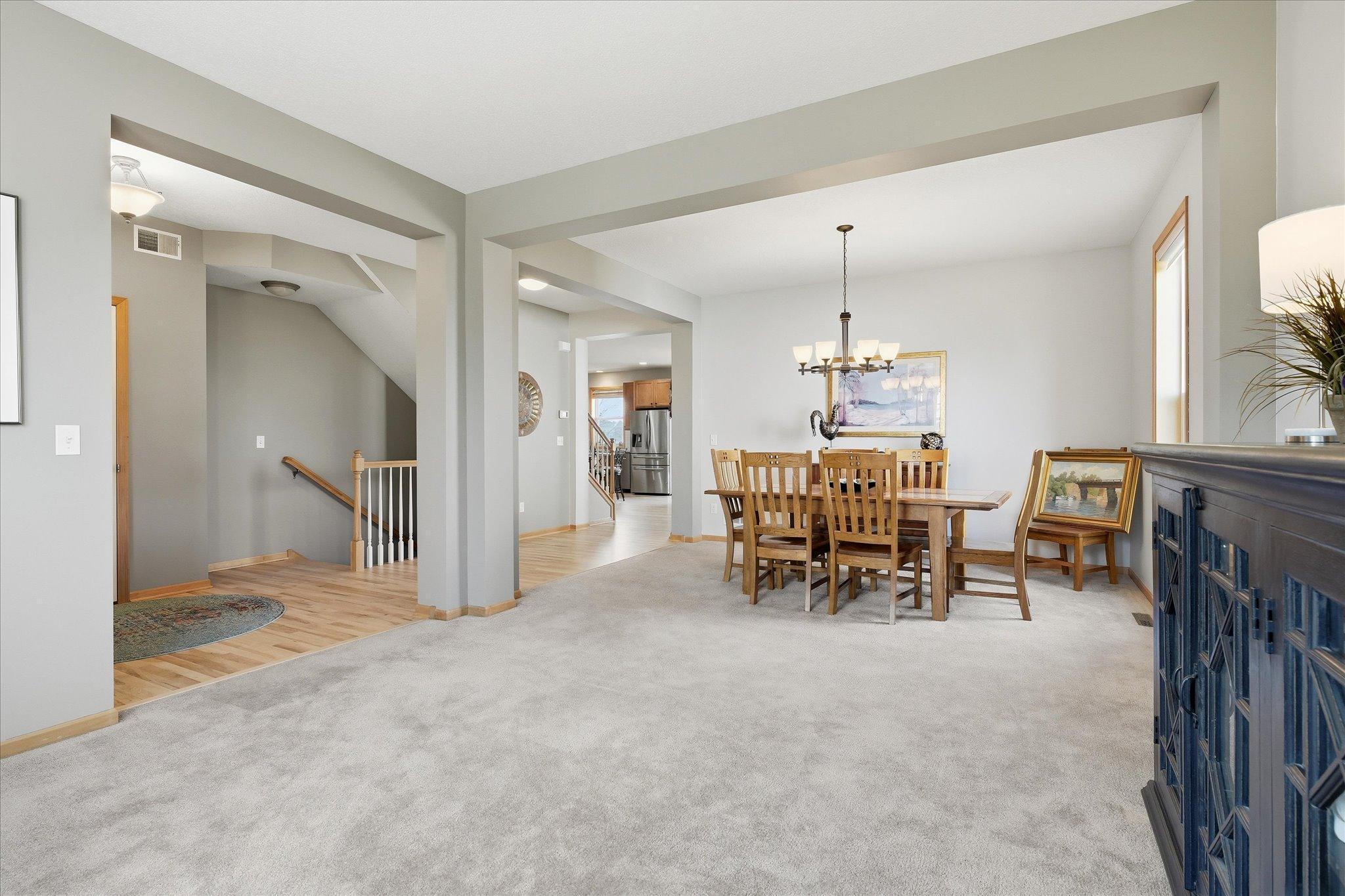 Main Level Living Room opening to Dining Room. Either could be future office areas