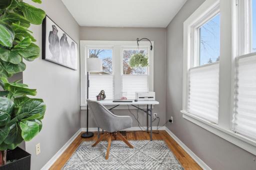 Great main floor office/study. Beautiful windows with up down privacy shades to still let in the light from the large windows.