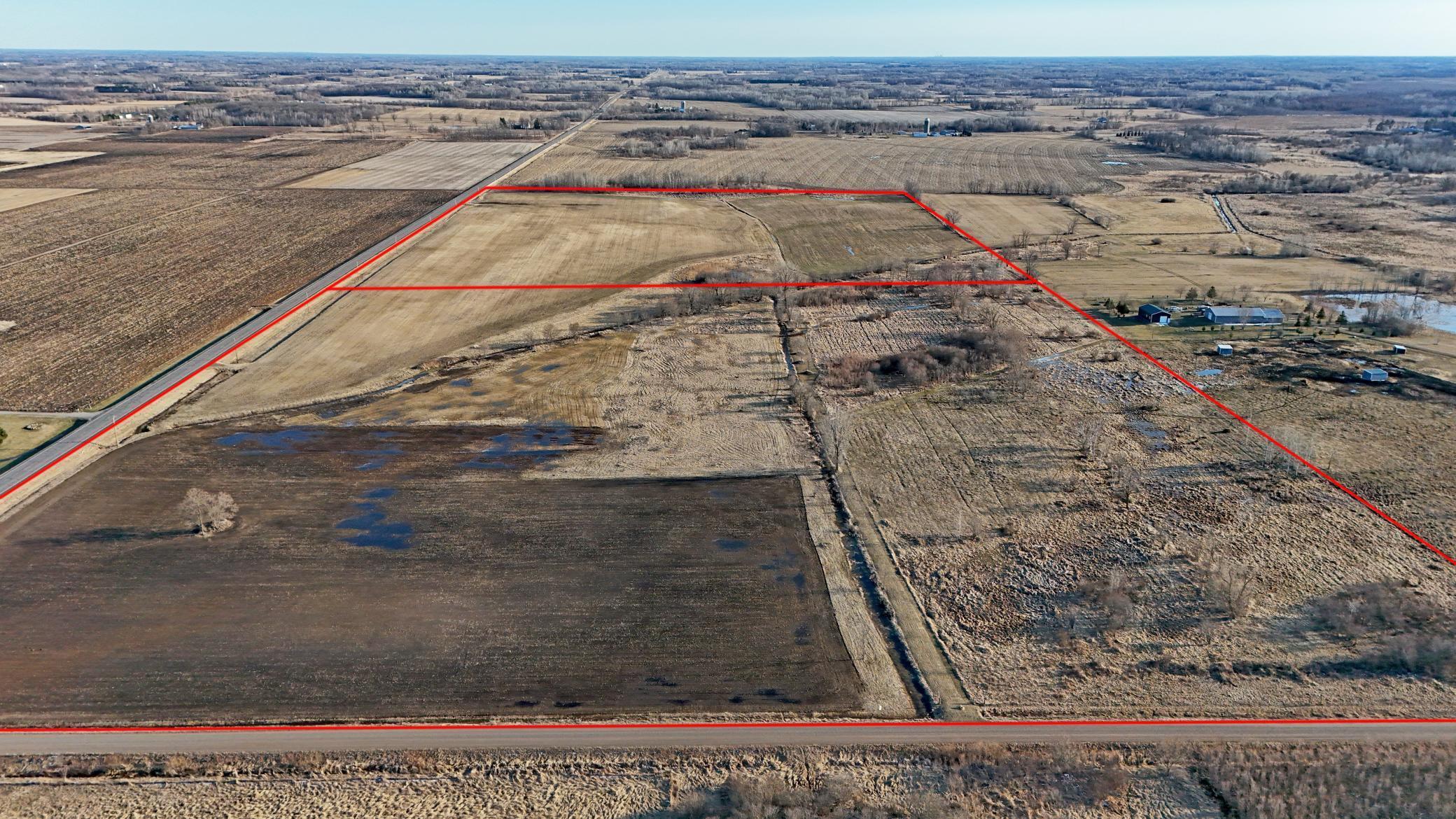 Subject property is the foreground of this photo with CR #9 serving as the east boundary and 125th Street NE as the north. Additional acreage is shown in the background (south of subject property) MLS #7050335