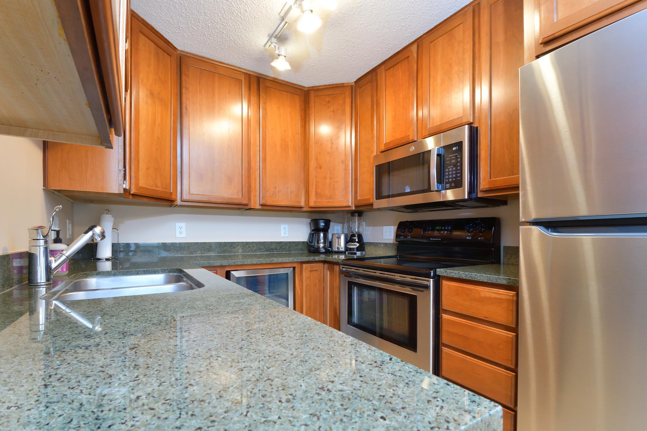 Kitchen detail highlighting beverage fridge and modern finishes