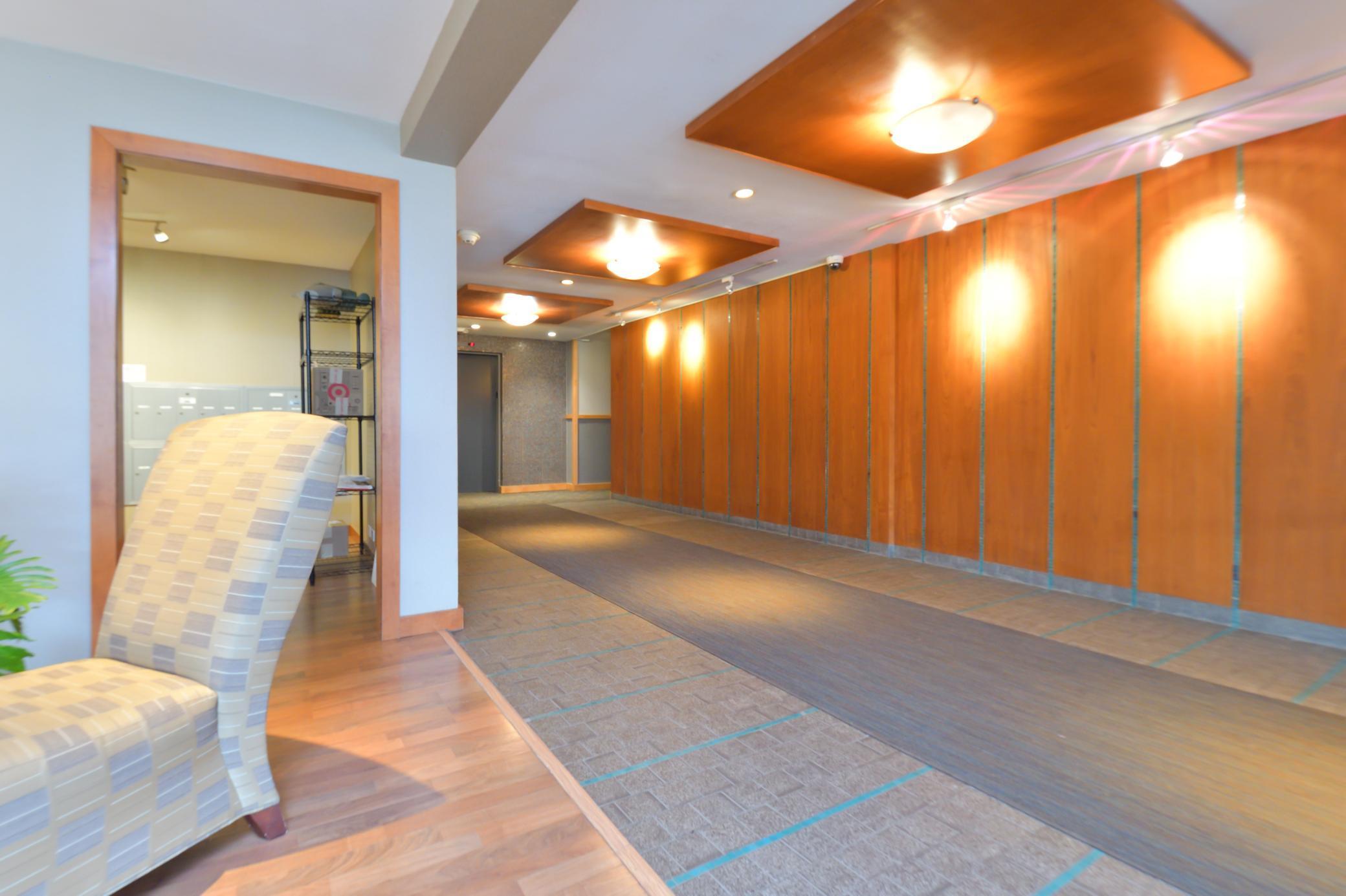 Interior walkway leading to elevator and private condo units