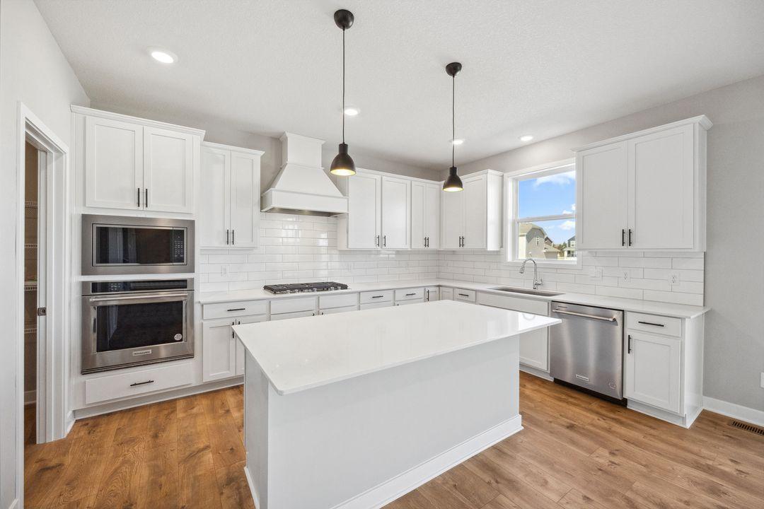 A huge walk-in pantry plus tons of cabinet storage for the largest grocery runs! Model photo, options and colors may vary.