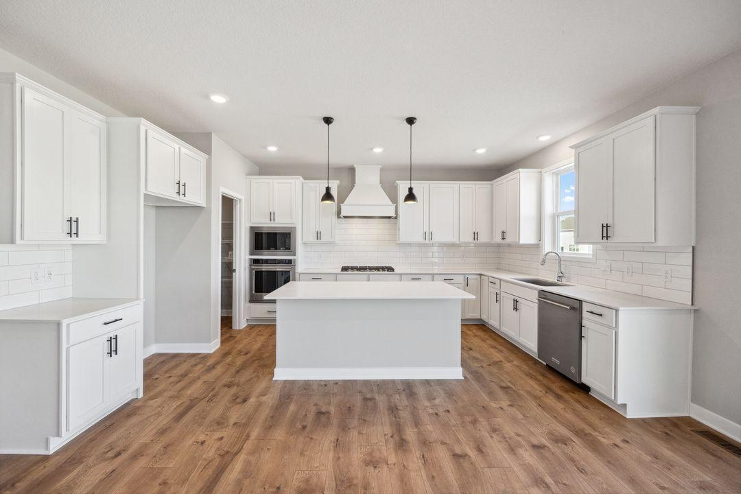 Upgraded Kitchen-Aid appliances. Model photo, options and colors may vary.