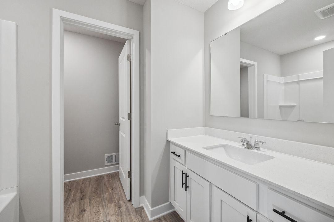 Upstairs hall bath serving just two bedrooms. Model photo, options and colors may vary.
