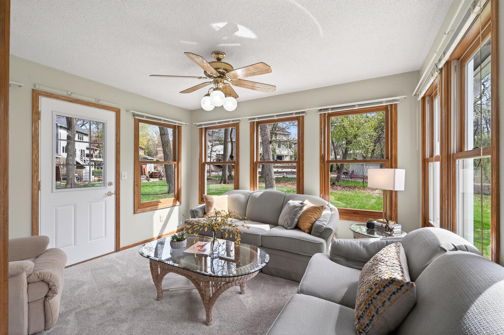 Sun room loaded w/windows and door to patio