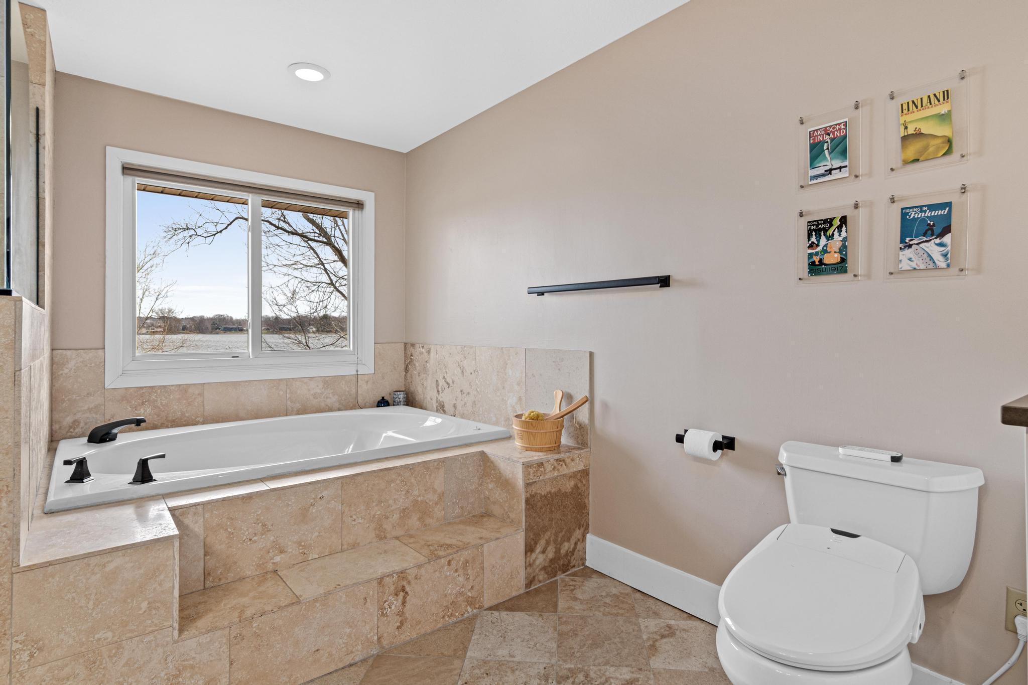 Primary bath with window overlooking the lake