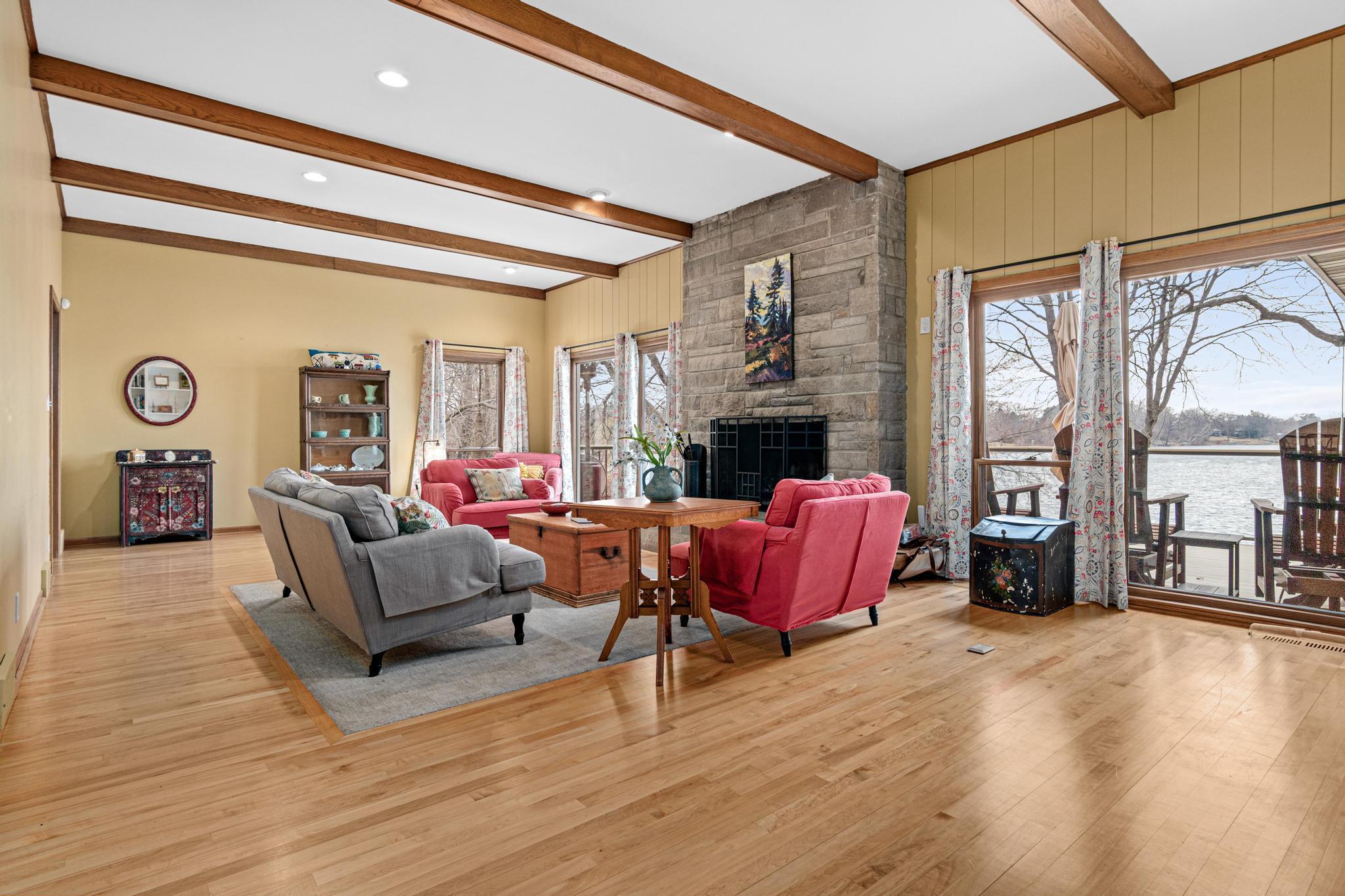 The living room is truly spacious with multiple views of the lake