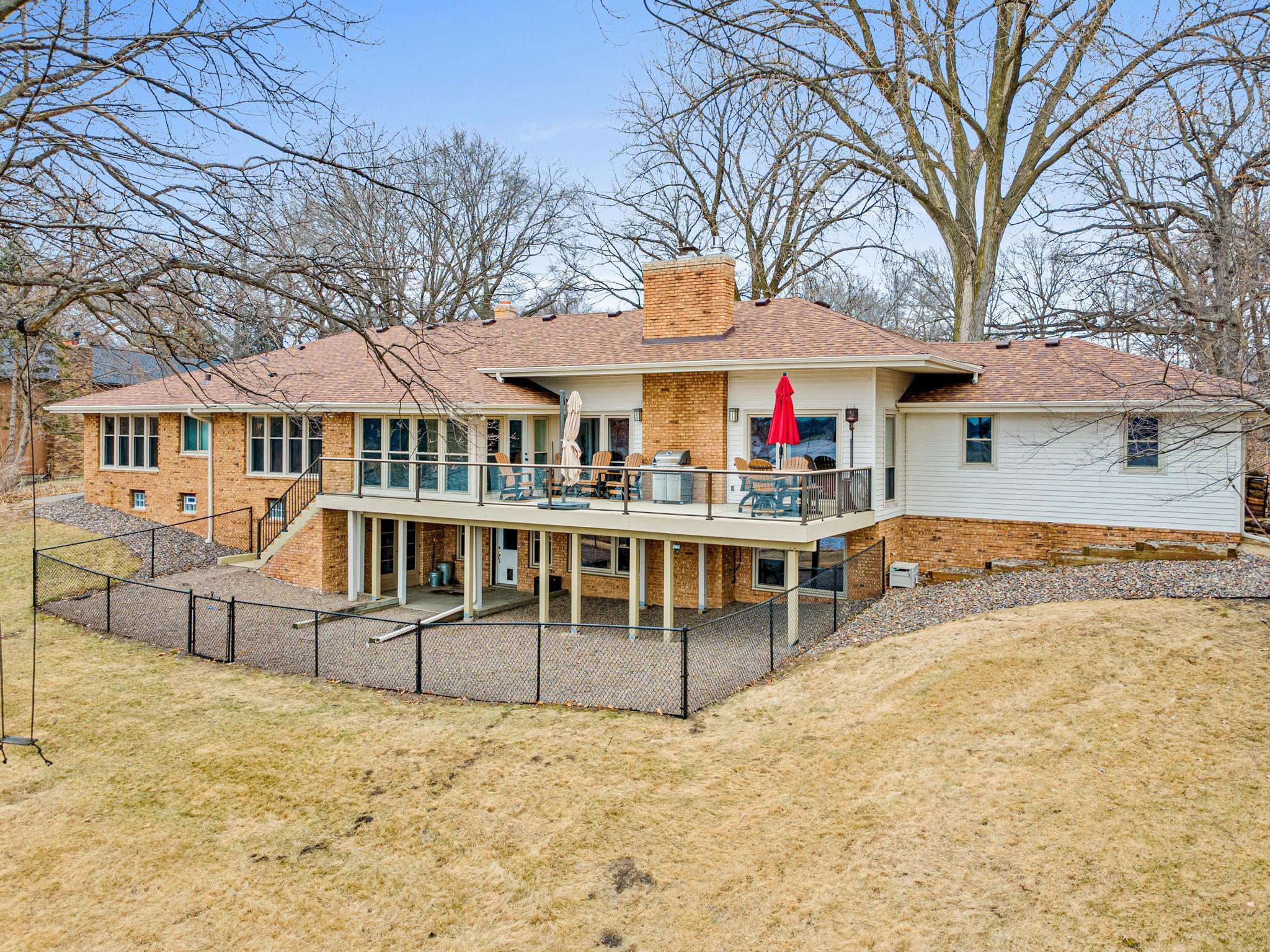 Rear of home with walkout from lower level