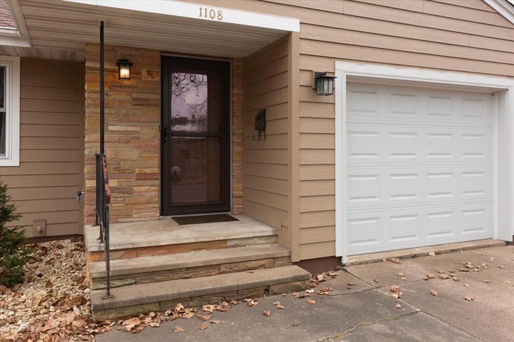Covered front entry with stone accents - great curb appeal