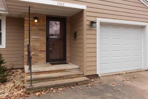 Covered front entry with stone accents - great curb appeal