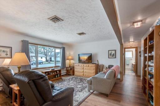 Living room has large picture window for lots of natural light