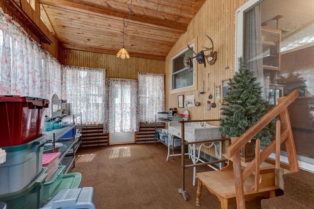 Enjoy this bright three season room overlooking the backyard.