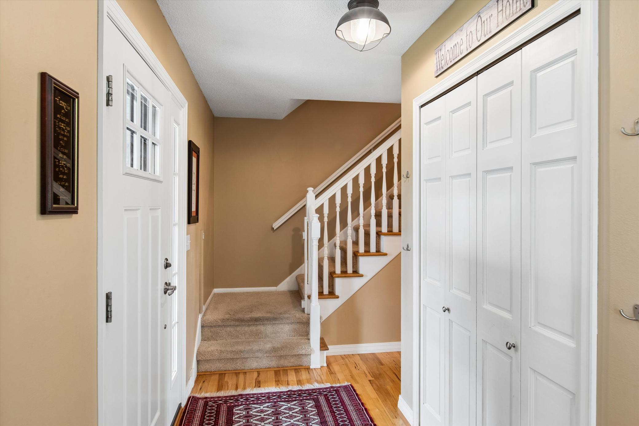 Foyer with large closet and Hickory Hardwood flooring.