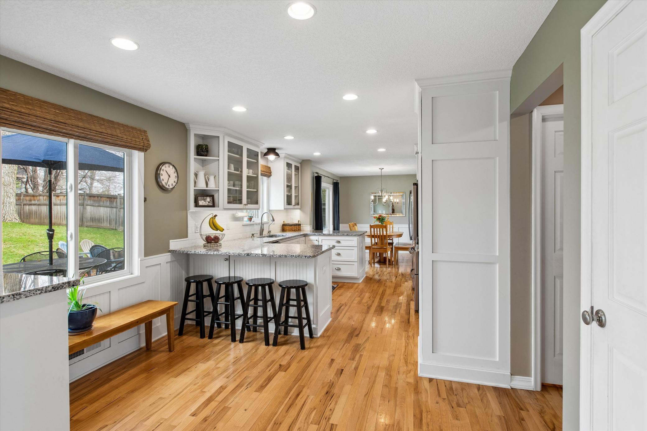 Kitchen view with Hickory Hardwood flooring.