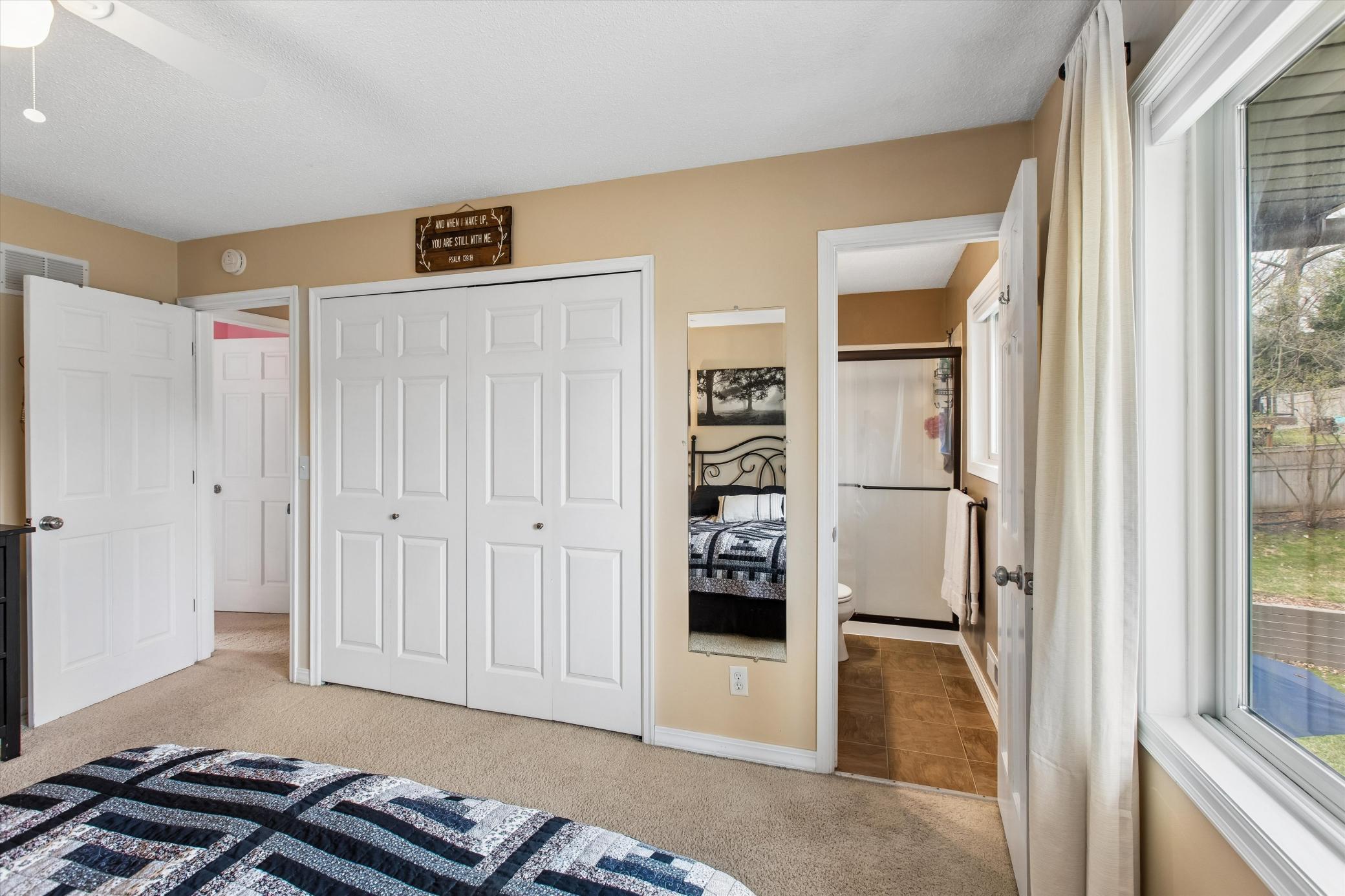 Primary Bedroom with view to 3/4 Bathroom.